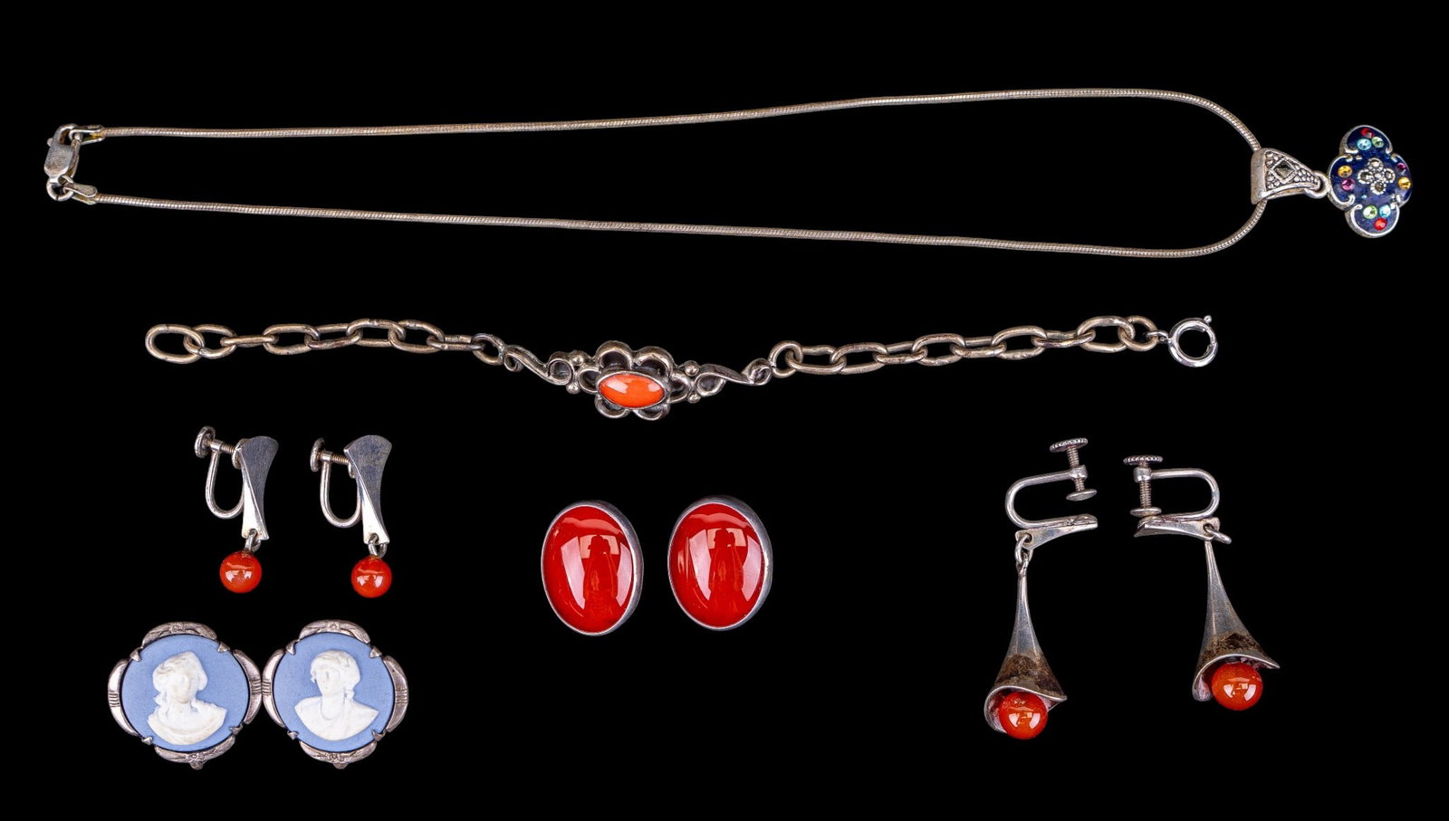 Carnelian, Margaret Craver, & Other 925 Jewelry: A collection of sterling silver jewelry including a pair of Wedgwood Jasperware screwback earrings, an Art Nouveau signed bracelet featuring a coral cabochon, two pairs of modern carnelian bead screwb