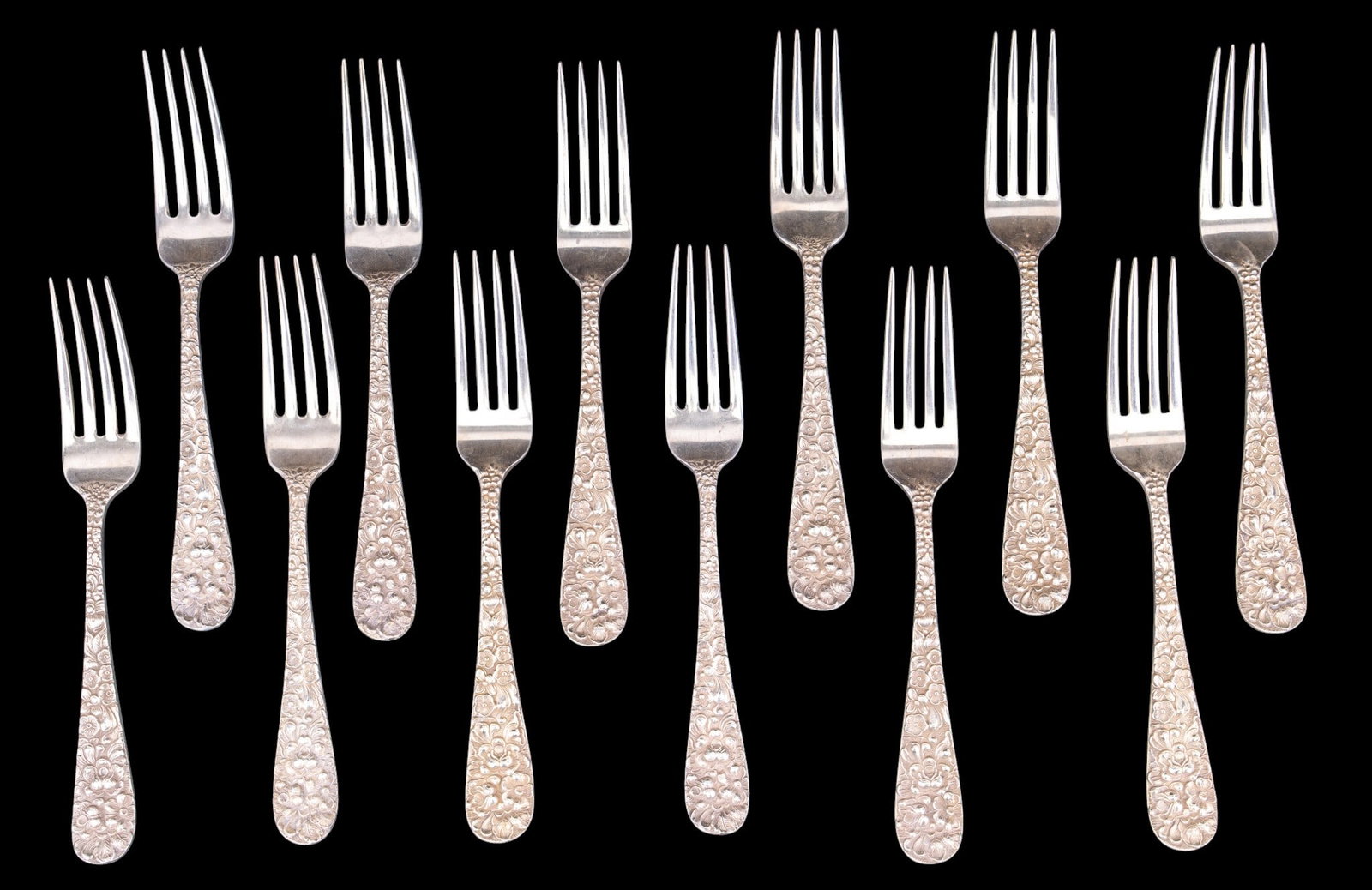 Stieff Rose Sterling Dinner Forks 12pc.: 12 Stieff rose sterling silver dinner forms each measuring approx. 6.75in long. Total sterling weight 683.58 grams.