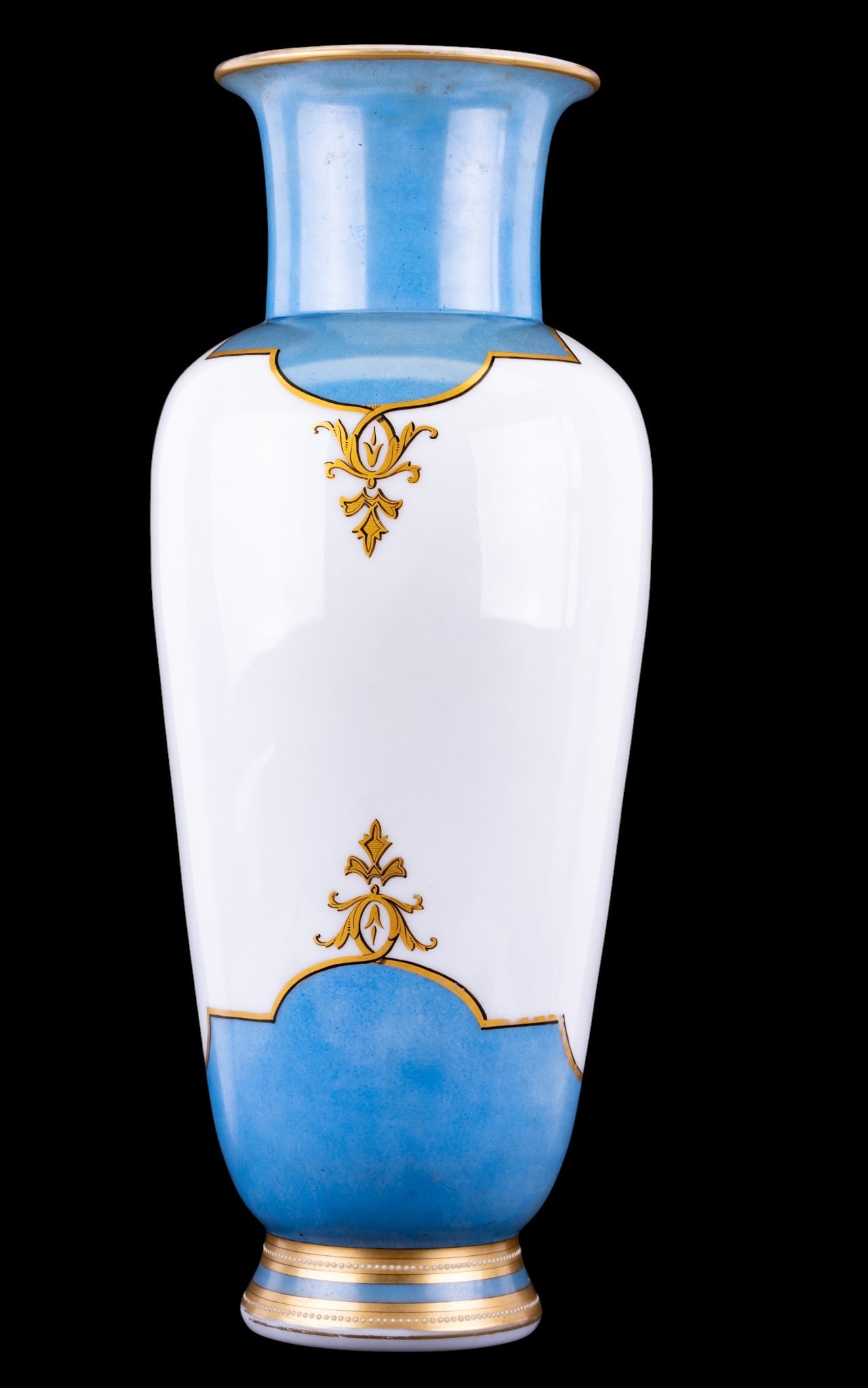 Hand Painted Opaline Glass Vase: A large early hand painted opaline glass vase featuring a blue, black, and gold motif. Note adhesive residue on the inside of the flared rim, measures approx. 22" H.
