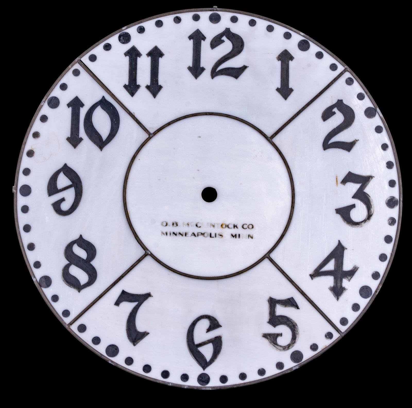 O.B. McClintock Co. Leaded Glass Dial: Large-scale leaded opaline glass clock dial by O.B. McClintock Co., Minneapolis, Minn., comprised of glass panels with black Arabic numerals and minute markers. Measures approx. 25" Diameter.
