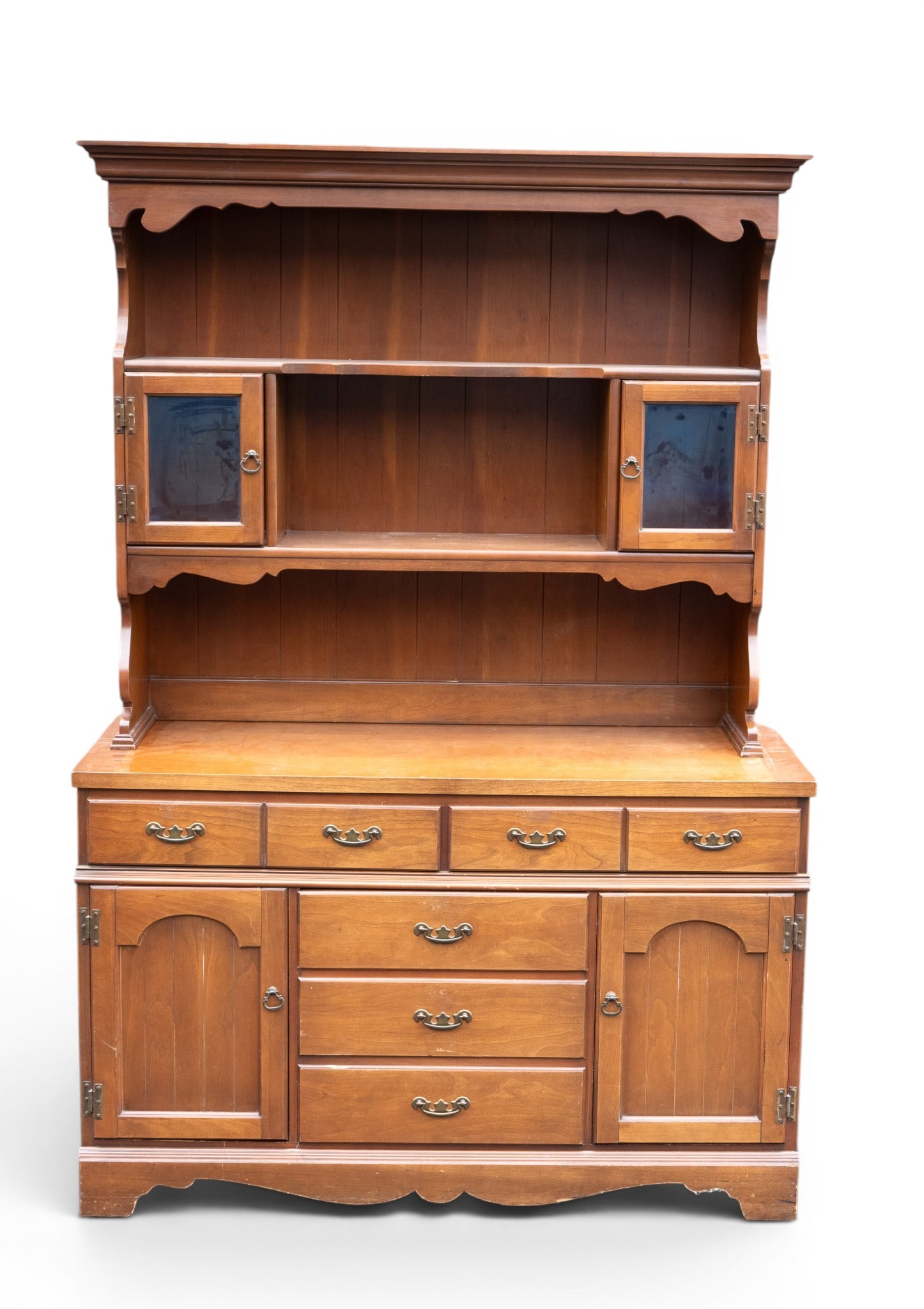 Cherry Hutch-Top Sideboard: 2-Piece cherry dining cabinet comprising of a buffet base and matching hutch. The upper section features open display shelving and a pair of glass cabinet doors. The buffet base offers 2 working