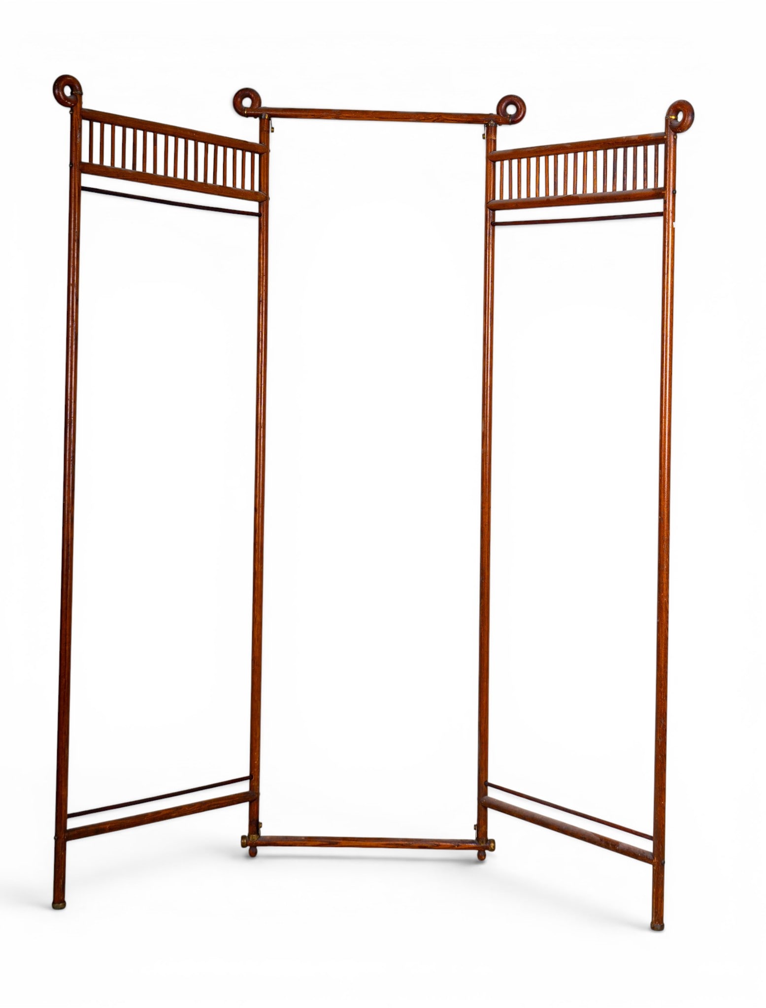 Antique Tri-Fold Partition Screen Frame: Antique folding wooden partition or room screen frame featuring turned spindle galleries, scroll-form finials, and brass-capped feet. Measures approx. 62" H x 57" W (fully extended).