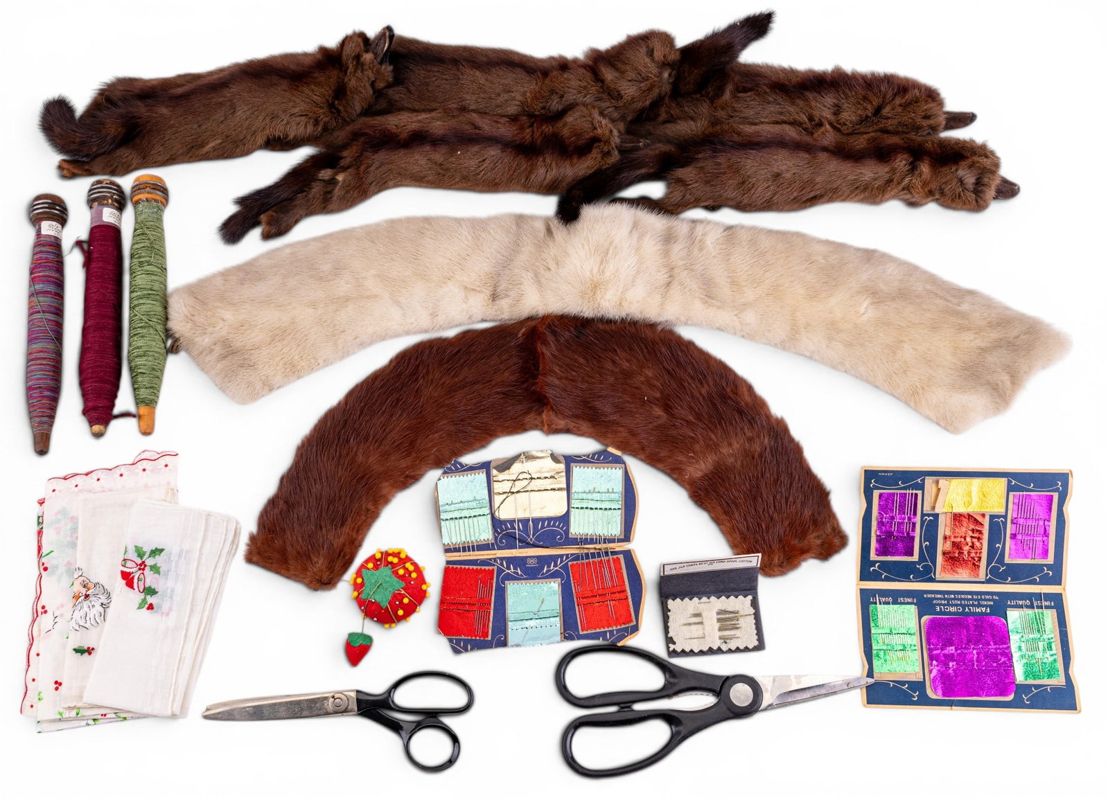 Vintage Fur Stole, Fur Collars, and Sewing: Group including a vintage fur stole, two fur collars, thread spools, tailor's shears, fabric scissors, pincushion, handkerchiefs, and others.