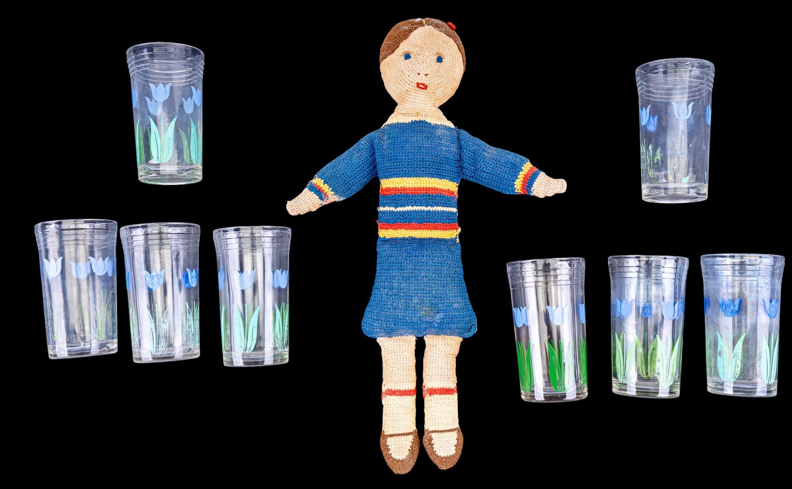 Folk Art Handmade Rag Doll, 8 Tumblers: Includes a vintage crotcheted rag doll dressed in blue knit outfit, along with 8 clear glass tumblers. Each tumbler measures approx. 4" H.