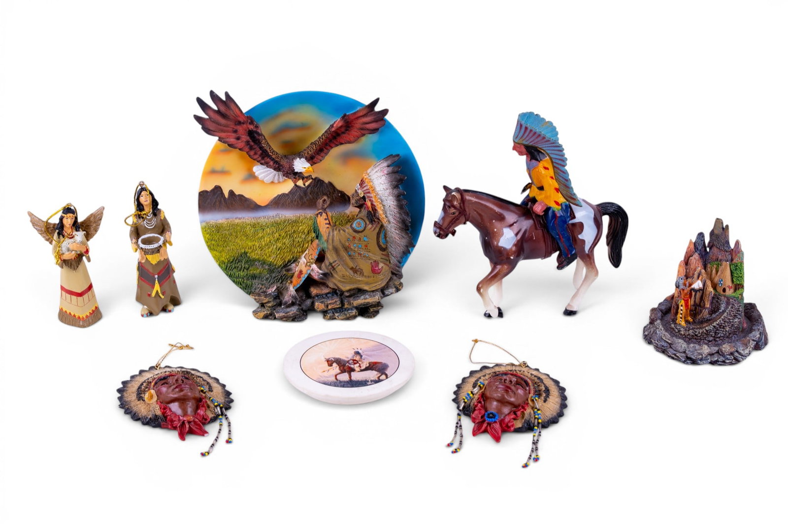 Native-Theme Decorative Items: Collection of Native-themed decorative items including a T.F.M. Spirit of the Wolf hand-painted limited edition sculptural paperweight, three-dimensional plaque featuring a Native chief and eagle,