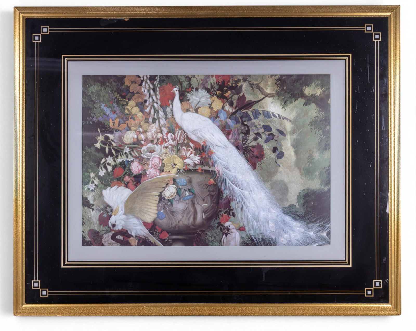 Monumental Framed Decorator Art Peacock Print: A monumental size framed decorator art print depicting a white peacock and cockatoos in a colorful floral garden, featuring a black and gold reverse painted geometric border design, note some loss,