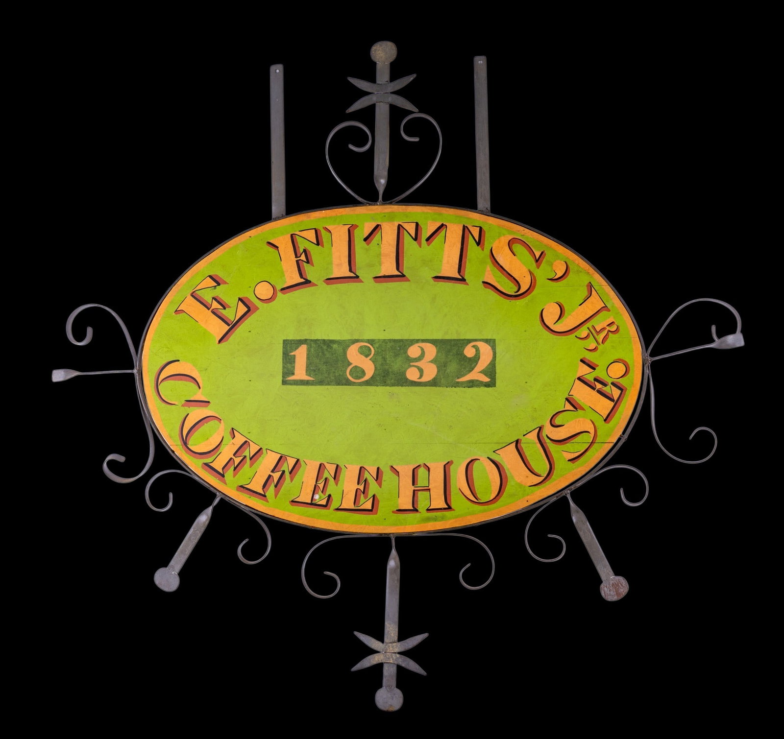 Contemporary Antique Style Coffee House Sign: An contemporary decorative antique style hand painted wood and metal sign featuring lettering for 'E. Fitts Coffee House 1832'. Measures approx. 33.5" W x 32" H.