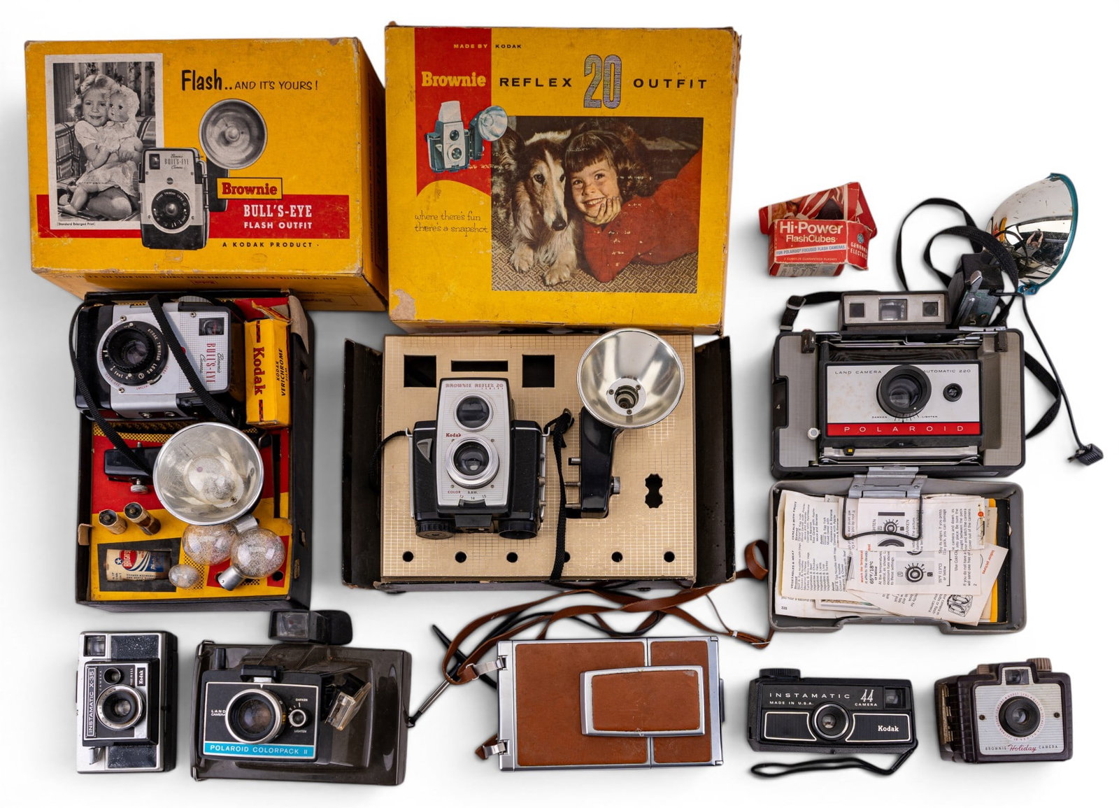 Vintage Camera Group: Collection of vintage cameras including a Polaroid Model 220 Land Camera with flash attachment, Polaroid Colorpack II Land Camera, Kodak Brownie Holiday Camera, Kodak Instamatic X-35 Camera, Kodak Ins
