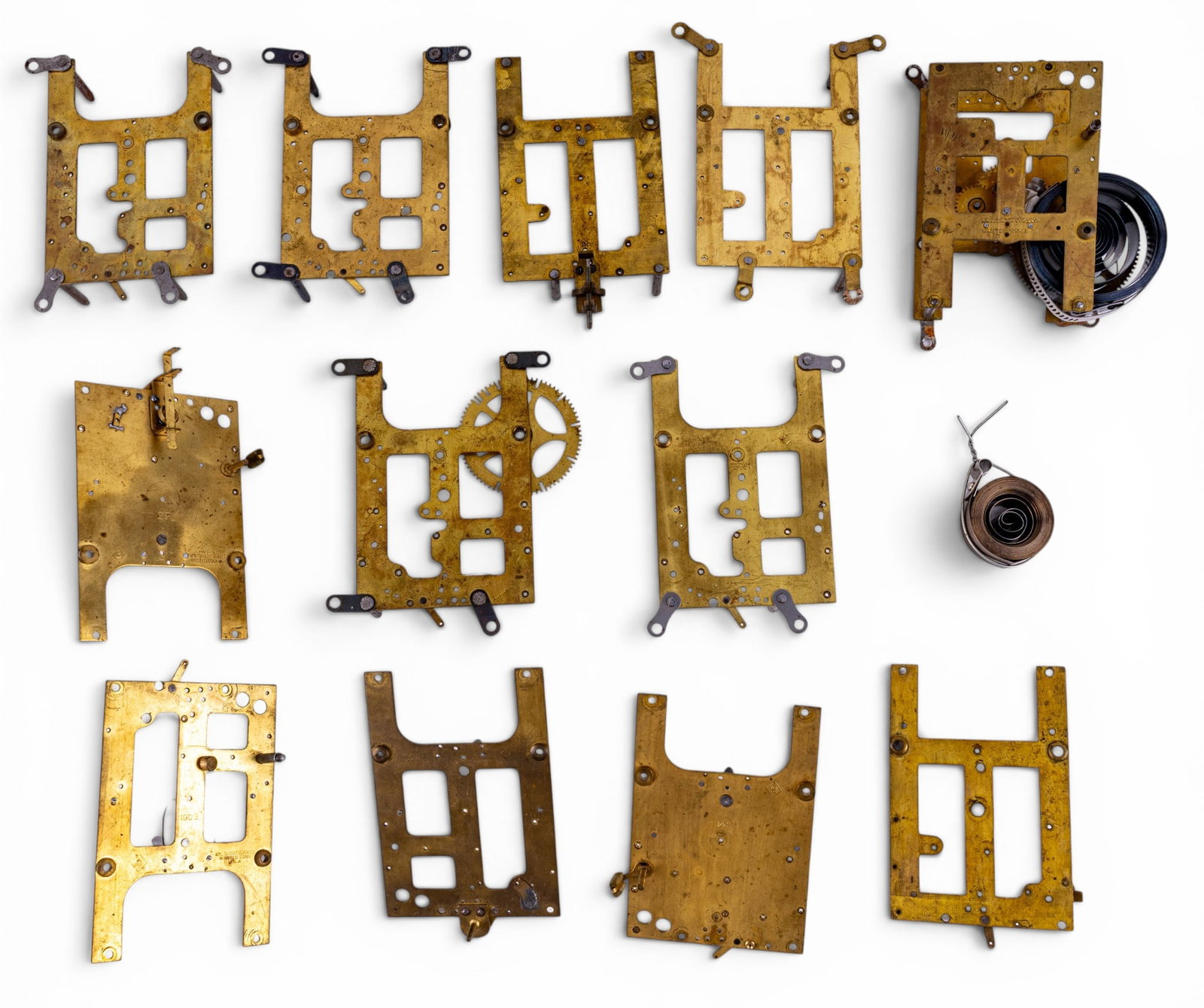 Early Clock Movements: A group of partially assembled early brass clock movements, many marked Gilbert Clock Co. Winsted Conn, U.S.A. See photos.