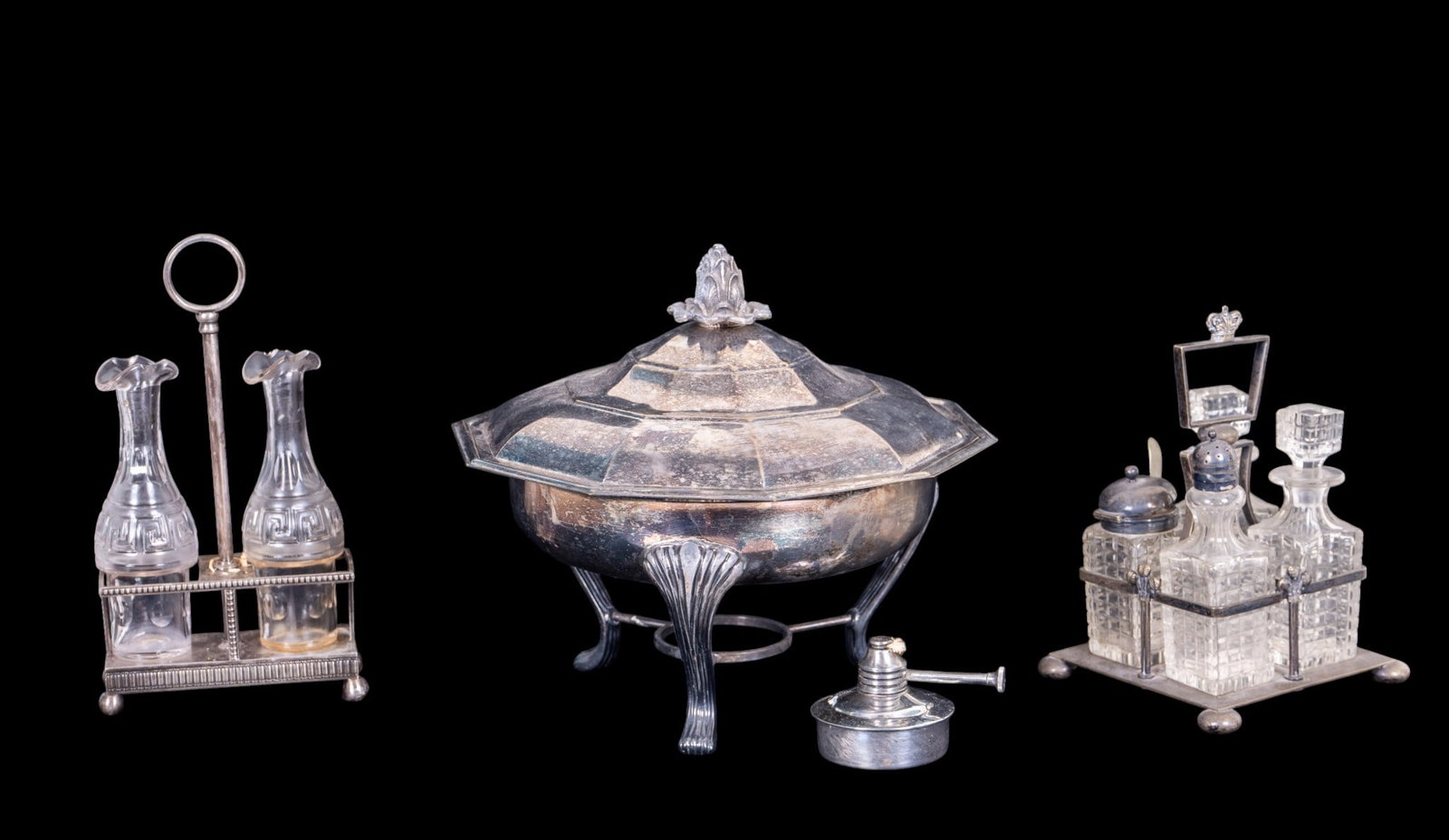Two Victorian & Later Silver Plated Cruet Sets: Both silver plated cruet sets are antique. Lot includes silver plated serving dish with alcohol burner and glass insert. One set with English crown.