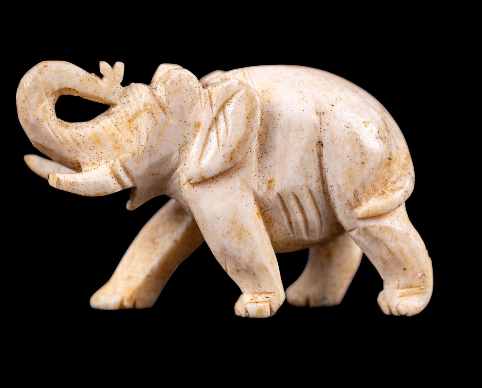 Small Natural Material Elephant Figurine: Small-scale elephant figurine composed of natural material. Measures approx. 1.5" W. Must be a Pennsylvania resident to pick up.