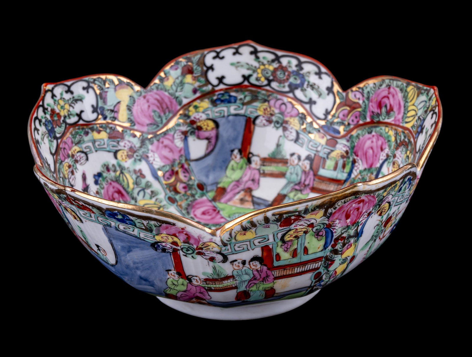 Chinese Famille Rose Lotus-Form Dish: Large Chinese porcelain lotus-form dish decorated in the famille rose palette with alternating figural courtyard scenes and floral, bird, and fruit motifs. Unmarked to underside. Measures approx.