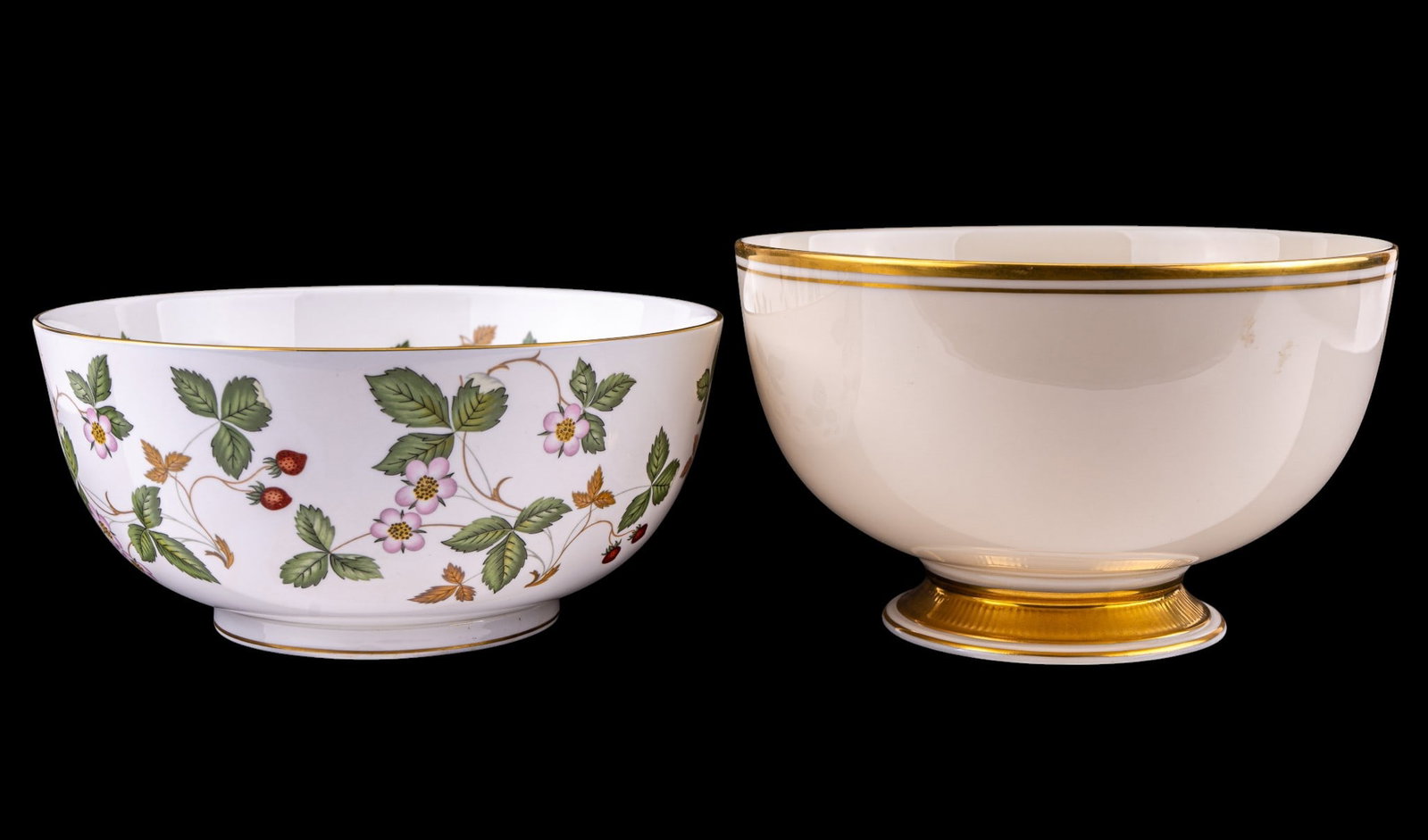 Fine China Serving Bowls: Includes a Wedgwood Wild Strawberry bone china serving bowl, made in England, featuring strawberry vine motif with gilt rim, and a Lenox porcelain serving bowl, made in the USA, decorated with gilt