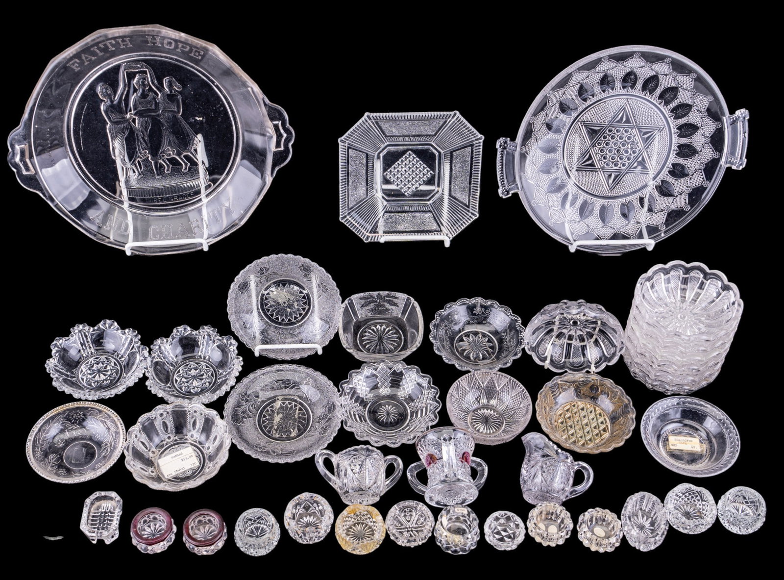 EAPG Plates, Berry Bowls, Salt Cellars: A collection of early American pattern glass salt celars, berry bowls, plates, and creamers and sugar jars on various vintage patterns.