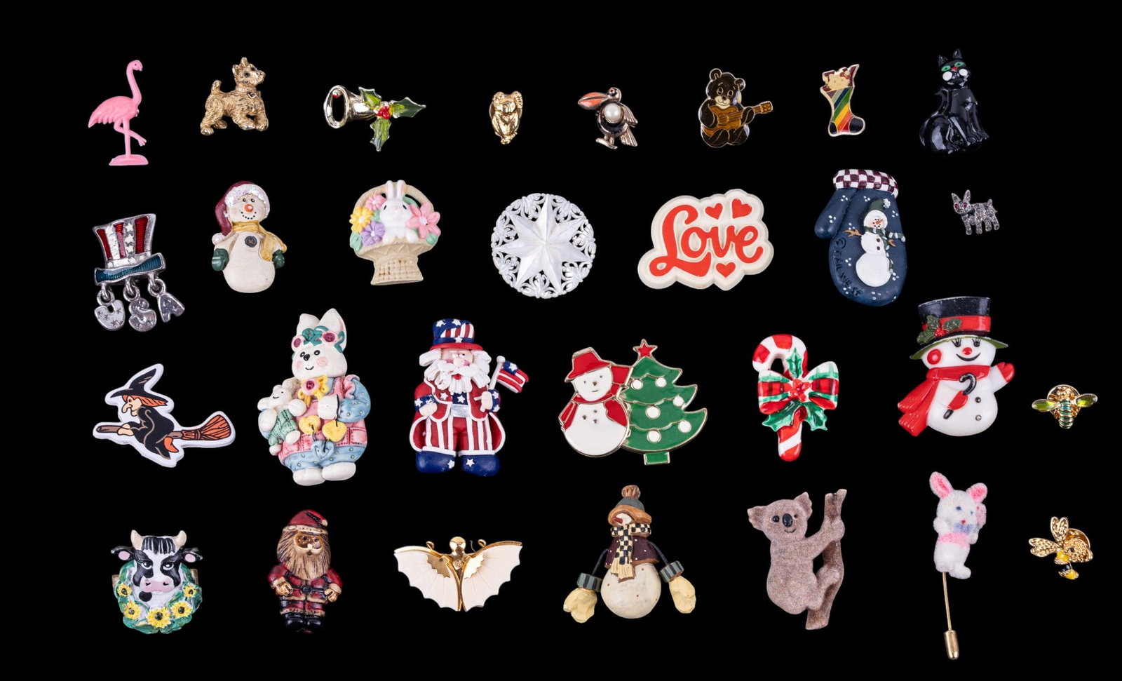 Vintage Holiday and Animal Pins: A collection of vintage brooches featuring holiday themes such as Christmas and Easter, and an assortment of vintage animal themed pins, featuring rhinestones and enamel.