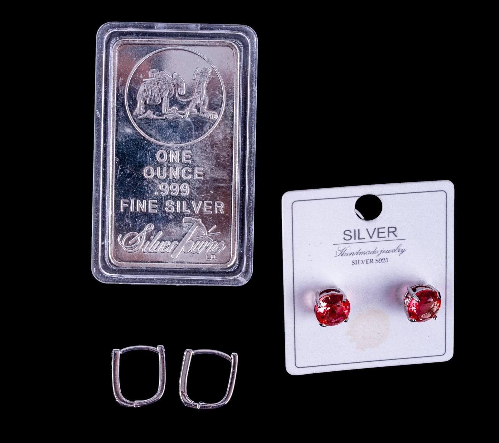 Sterling Silver Earring, .999 Silver Bar: A .999 silver bar from Silver Towne, a pair of solitaire round cut pink tourmaline and sterling silver stud earrings, and a pair of sterling silver hanged earrings with clear cut stones.