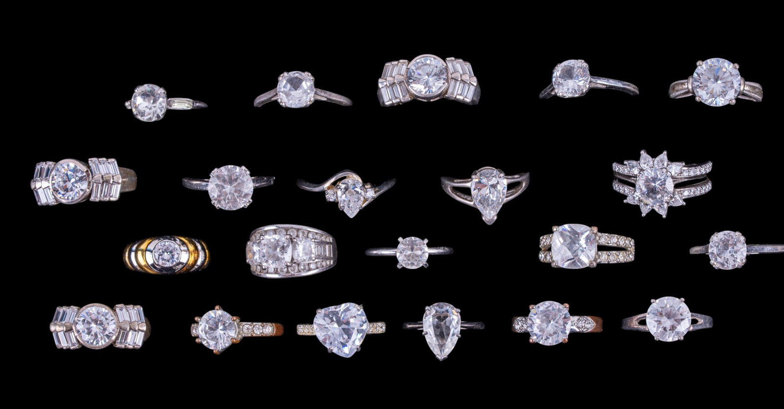 Sterling Silver Rings (21): A collection of 21 sterling silver rings featuring clear cut stones, sizes range from 5 to 9.