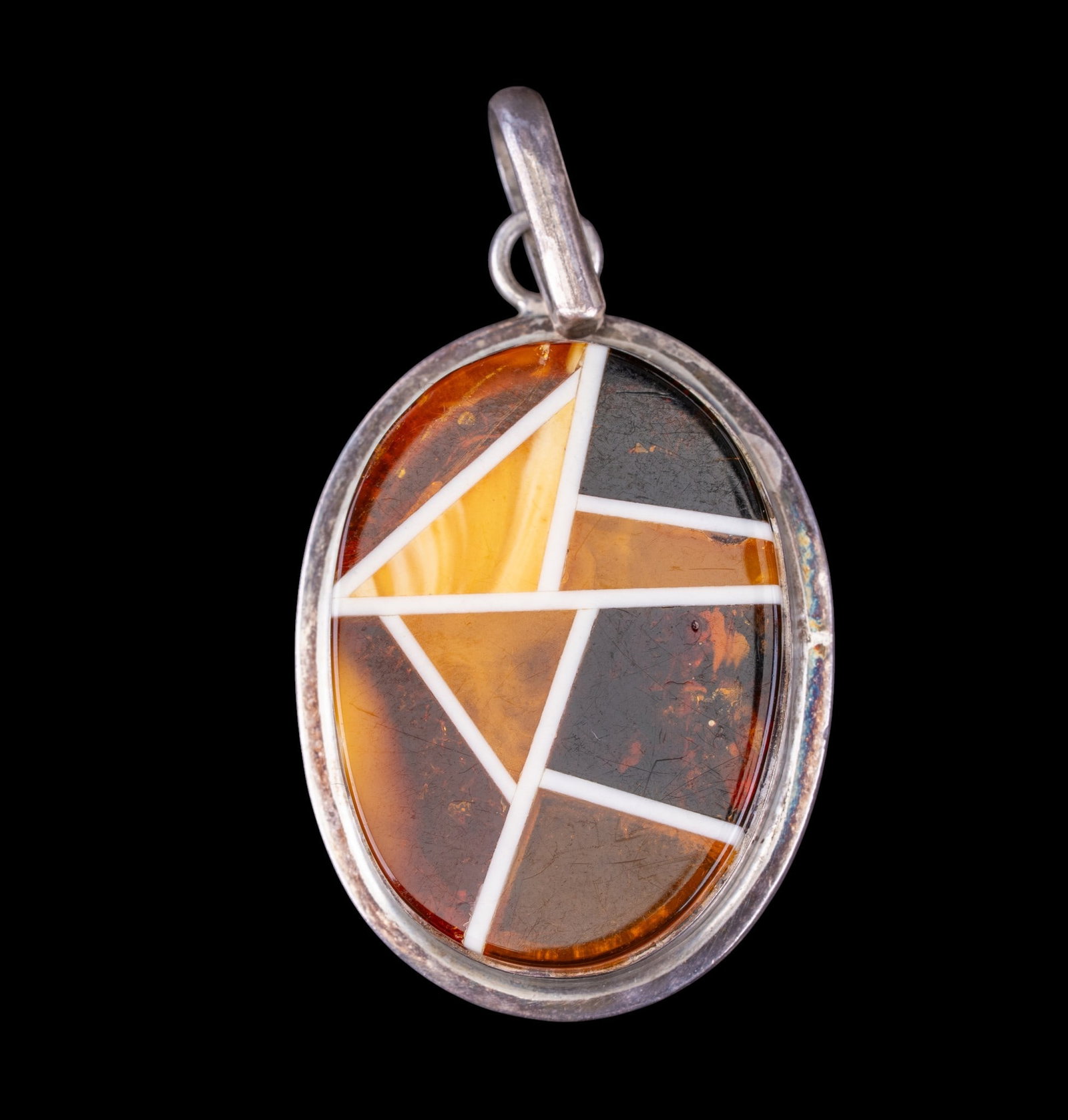 Vintage Amber Inlaid Pendant: Large oval multi-hued amber pendant with intricate inlay, sterling silver mount.