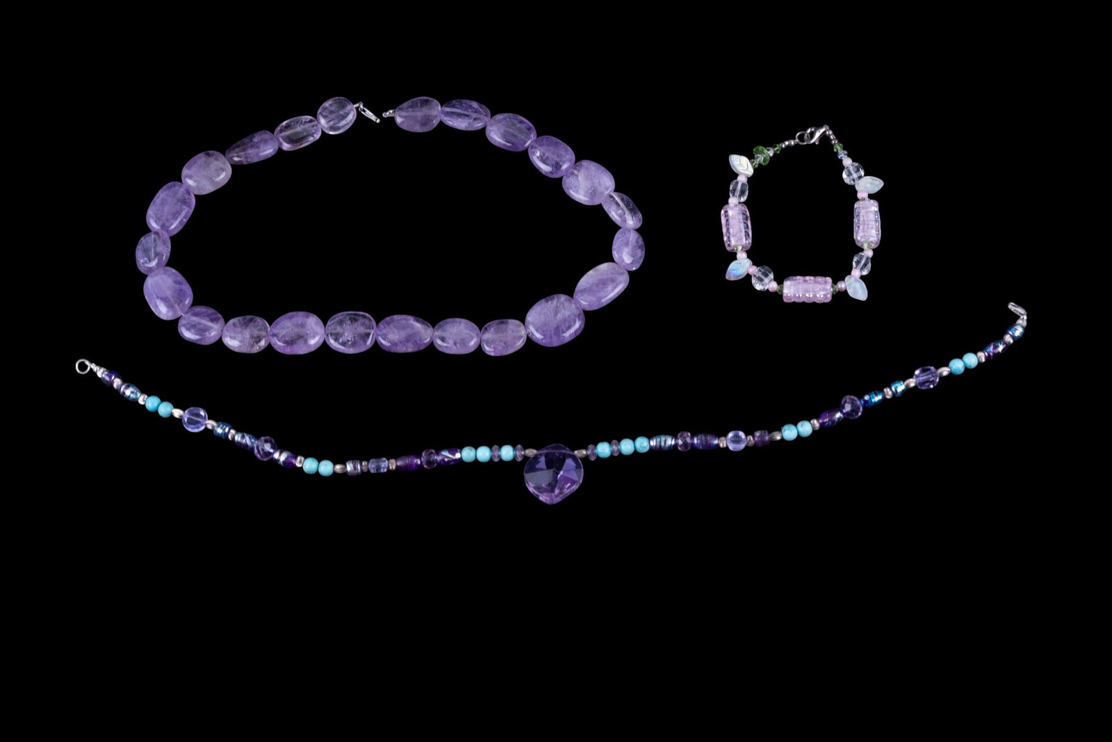 Amethyst and Other Necklaces: Amethyst stone necklace, glass necklace and bracelet; all with .925 sterling closures.