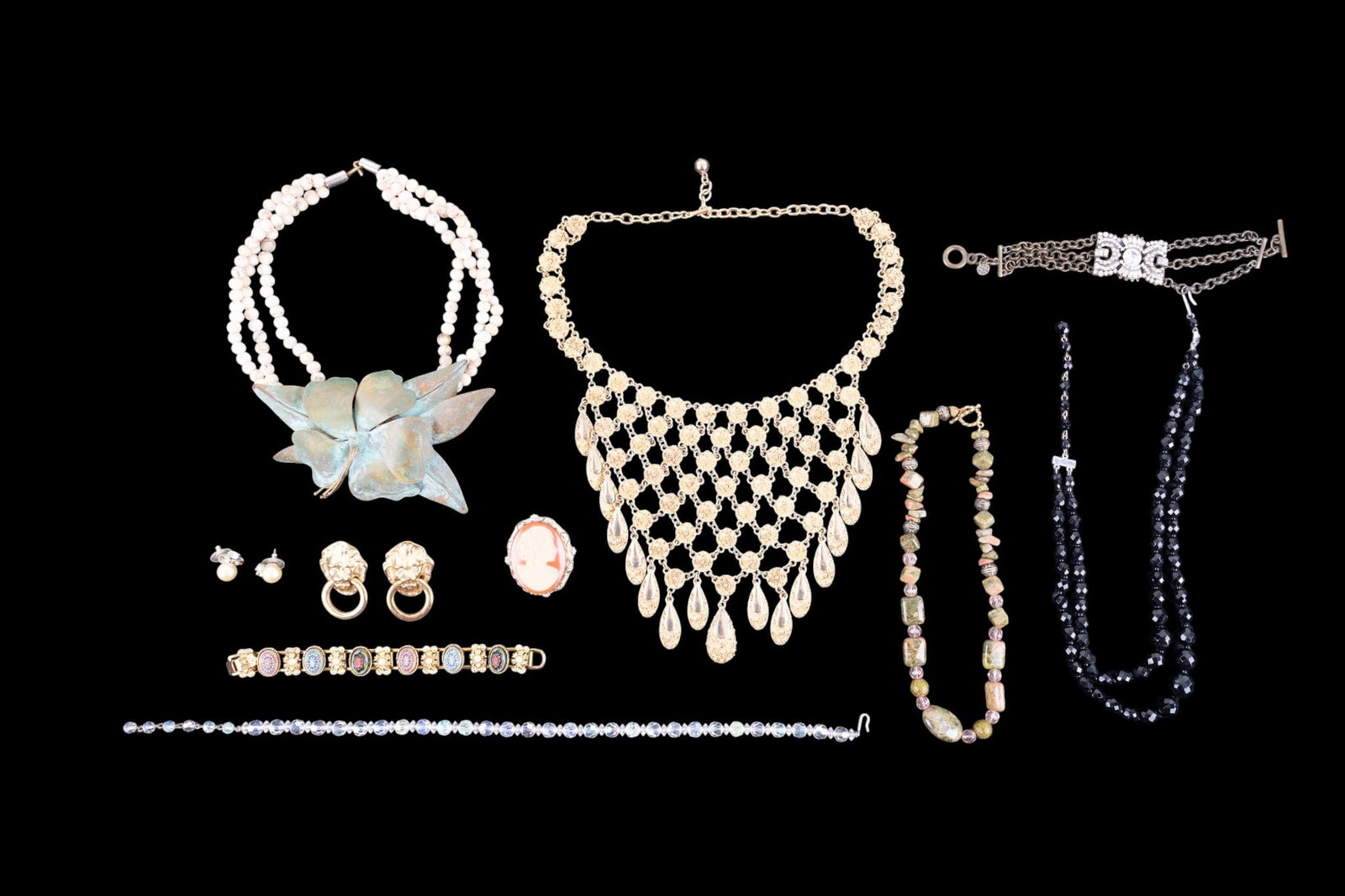 Stone and Vintage Jewelry: Includes several stone necklaces, Nolan Miller pearl earrings, K.J.L. lion earrings, crystal necklaces and more.