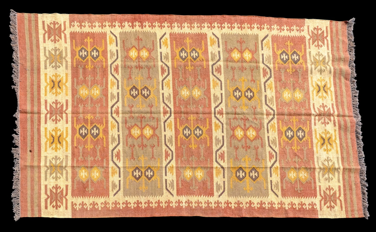 Hand-Woven Wool Jute Kilim Rug: Hand-woven wool Jute Kilim rug with repeating geometric motifs in shades of red, brown, and cream. Measures approx. 6'5" x 10'1".