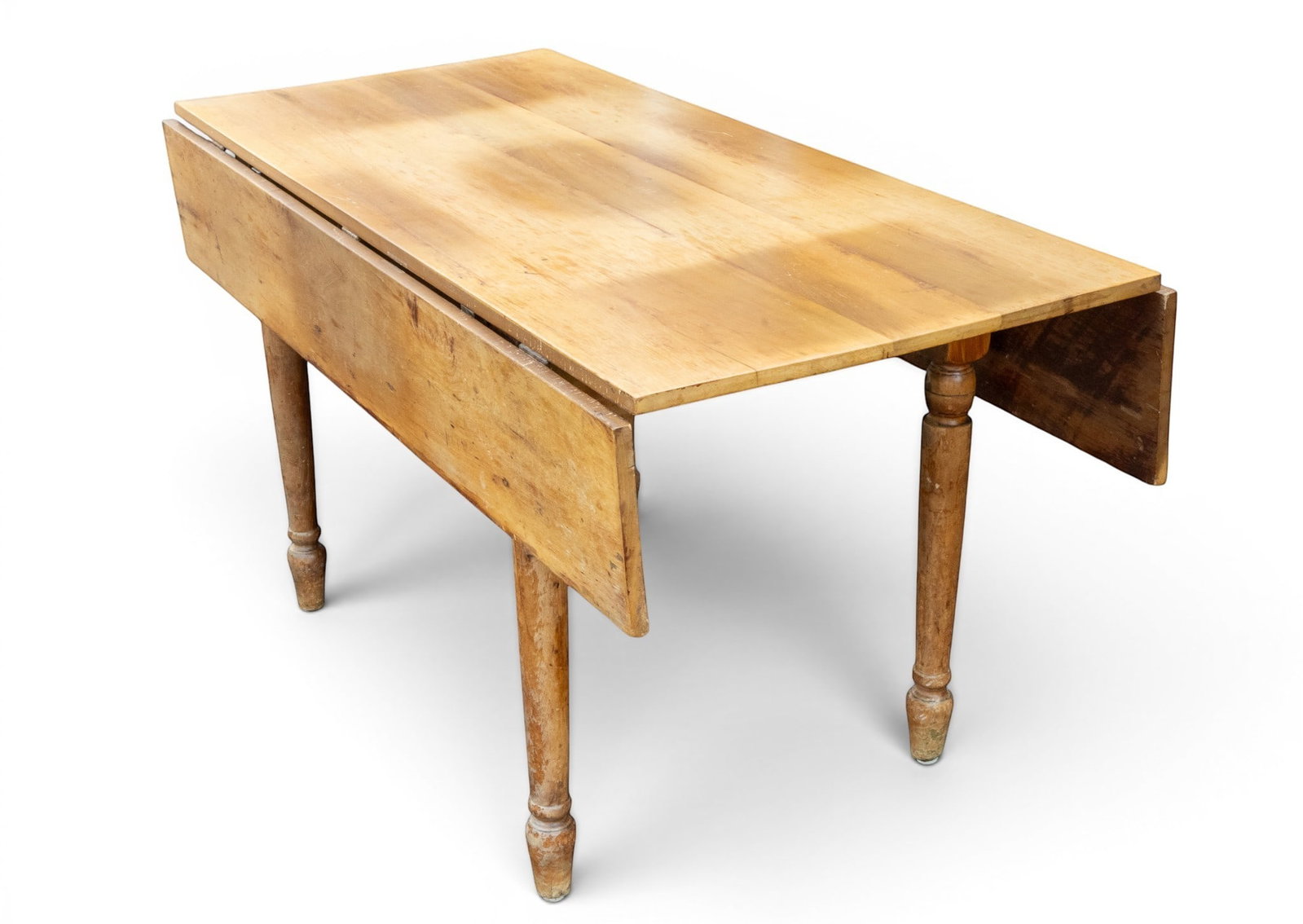 Antique Drop Leaf Farm Table: Antique wooden farm table with 2 drop leaves. Measures approx. 58" D x 31" H x 28" W x 43" W (with leaves open).