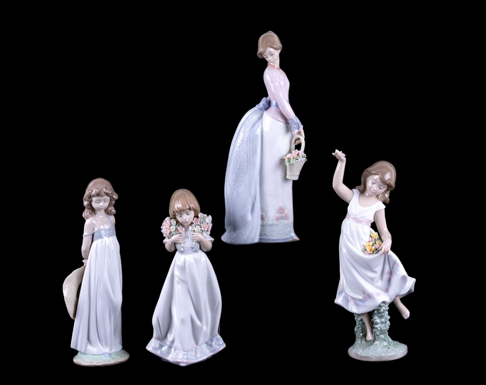 Lladro Porcelain Girls with Flowers (4): A collection of four Lladro porcelain figurines with original boxes depicting girls with flowers including No. 06580 Garden Dance, No. 07622 Basket of Love, No. 7.603 Spring Bouquets, and No. 01008114