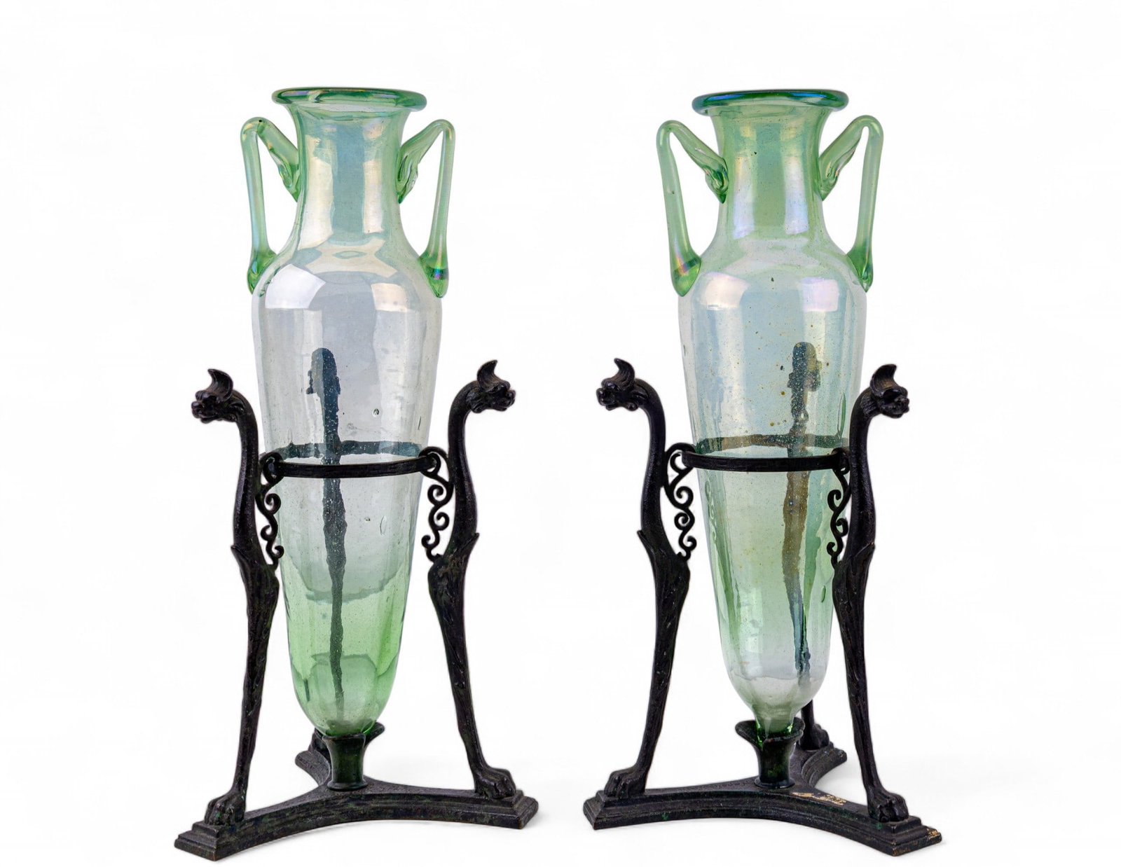 2 Italian Grand Tour Bronze Tripod Green Amphoras: Pair of antique Italian "Grand Tour" souvenir bronze tripod Athenienne with glass amphora. Blown glass green vessel with twin applied handles, resting in ornate bronze lion monopodia tripod stands. Ba