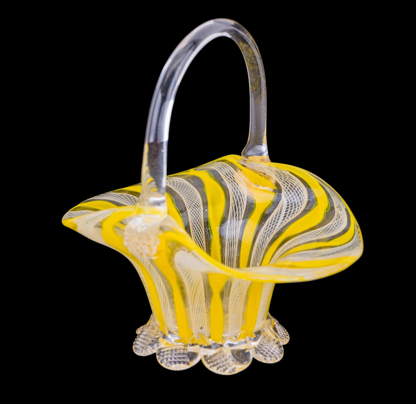 Mid Century Murano Latticino Glass Basket: A mid century hand blown Murano glass basket made using a yellow and white Latticino technique, measures approx. 5.5" W x 5" D x 6" H.