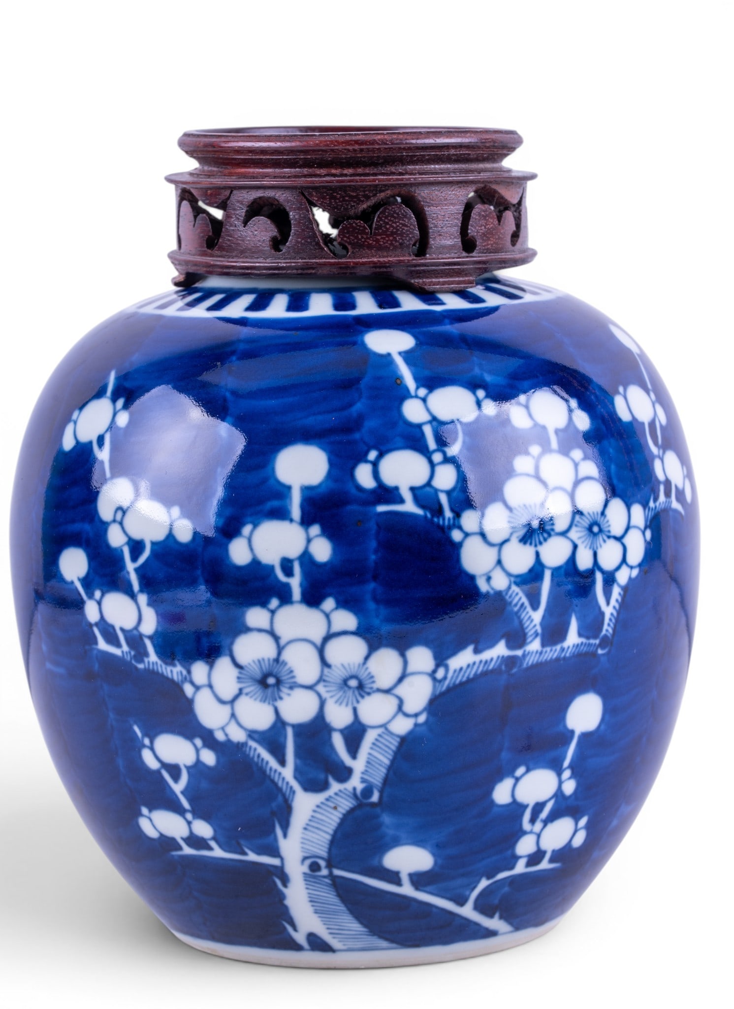 Chinese B&W Prunus Blossom Ginger Jar: Chinese porcelain ginger jar decorated in the prunus blossom pattern. Double blue ring mark to base along with red stamp "Hong Kong". Measures approx. 7" H.