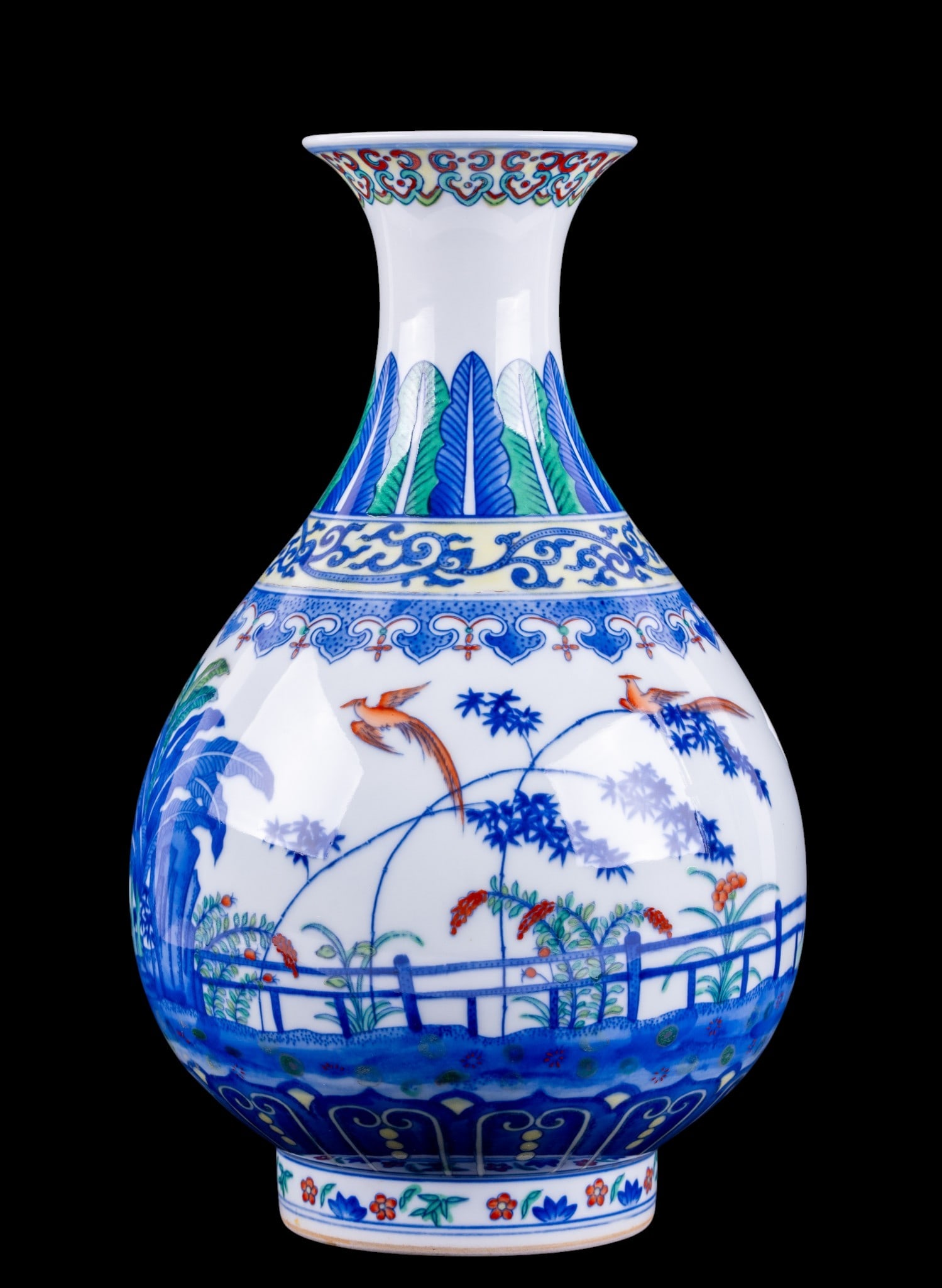 Chinese Blue and White Bottle Vase: Chinese 20th century hand painted porcelain bottle vase in plum shape decorated with a fenced garden landscape featuring flowering plants, bamboo, and a pair of phoenix birds. Underside with an underg