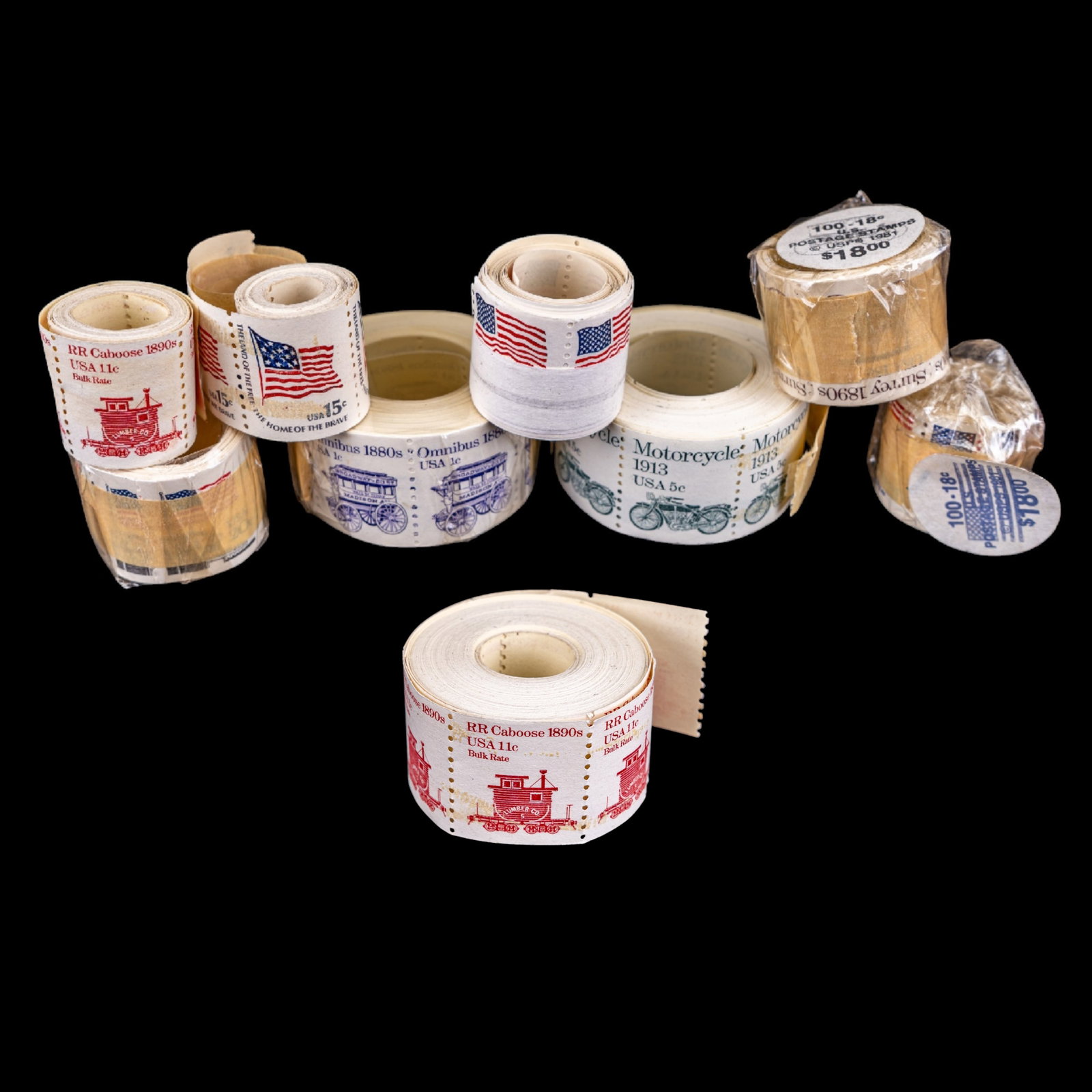 Collection of USPS Mint Stamp Rolls: Group of mint United States Postal Service self-adhesive and coil stamp rolls including un-sealed and sealed examples. Subjects include American Flag "From Sea to Shining Sea" "1880s Omnibus" 1913