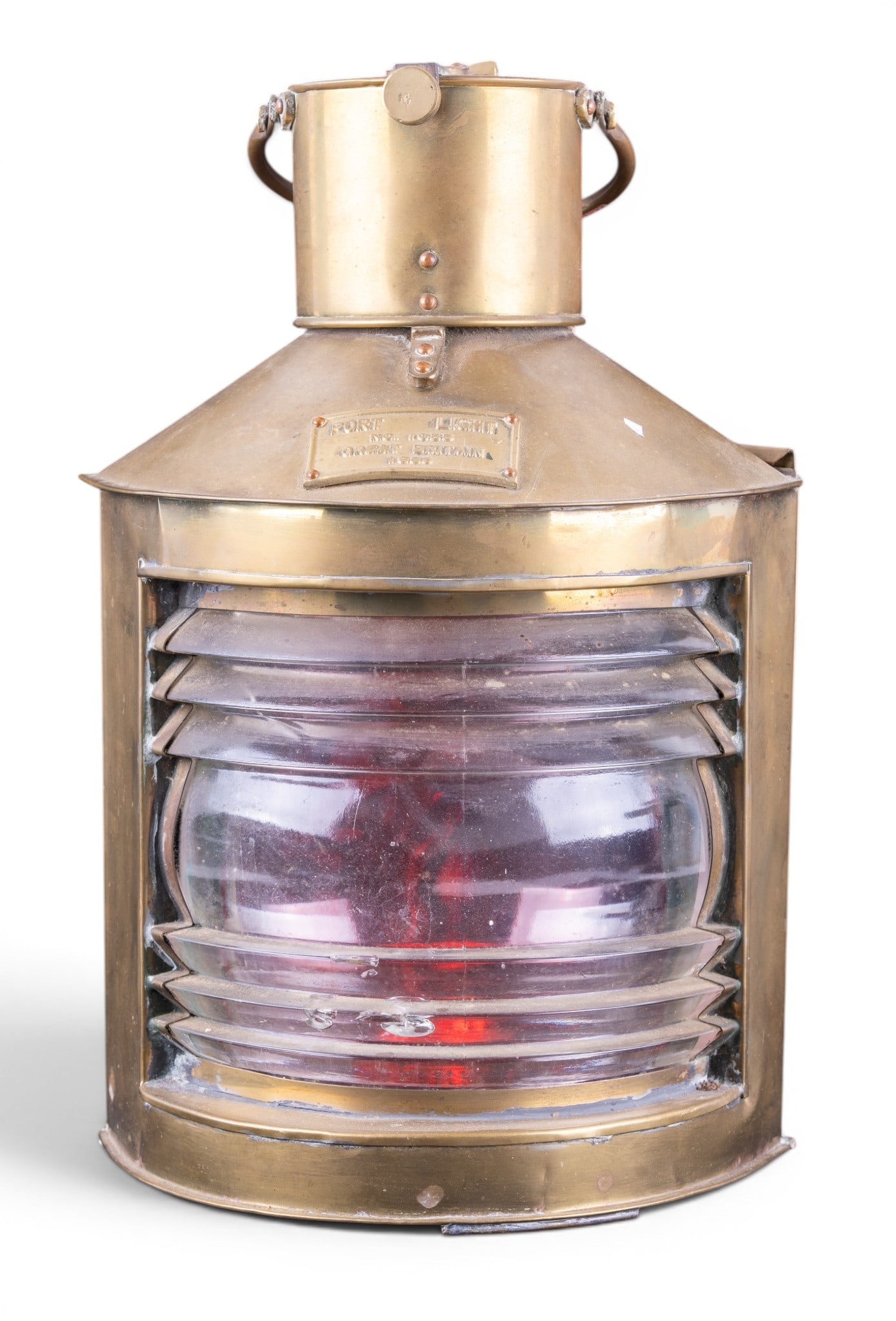 Brass Ship's Port Navigation Lantern, Britain 1933: Large brass ship's port navigation lantern with clear and red glass lens, slide access door, and carrying handles. Fitted with a cast plaque marked "Port Light No. 1933 Great Britain 1933. Measures
