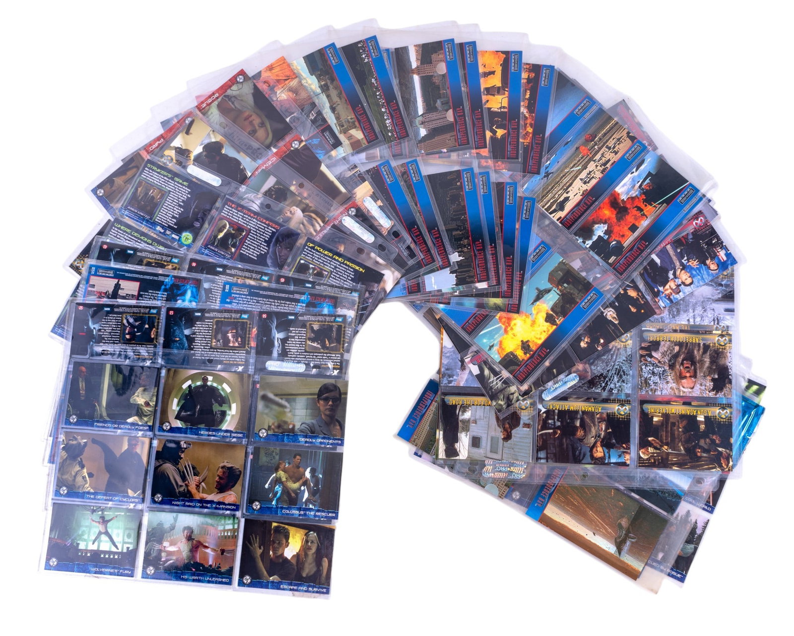 Topps X-Men Trading Cards, Independence Day: 14 sleeves of X-Men trading cards including examples from X-Men United and X-Men Topps trading cards. Along with over 70 Topps Independence Day trading cards in sleeves. c 1990s. Wolverine, Storm, man