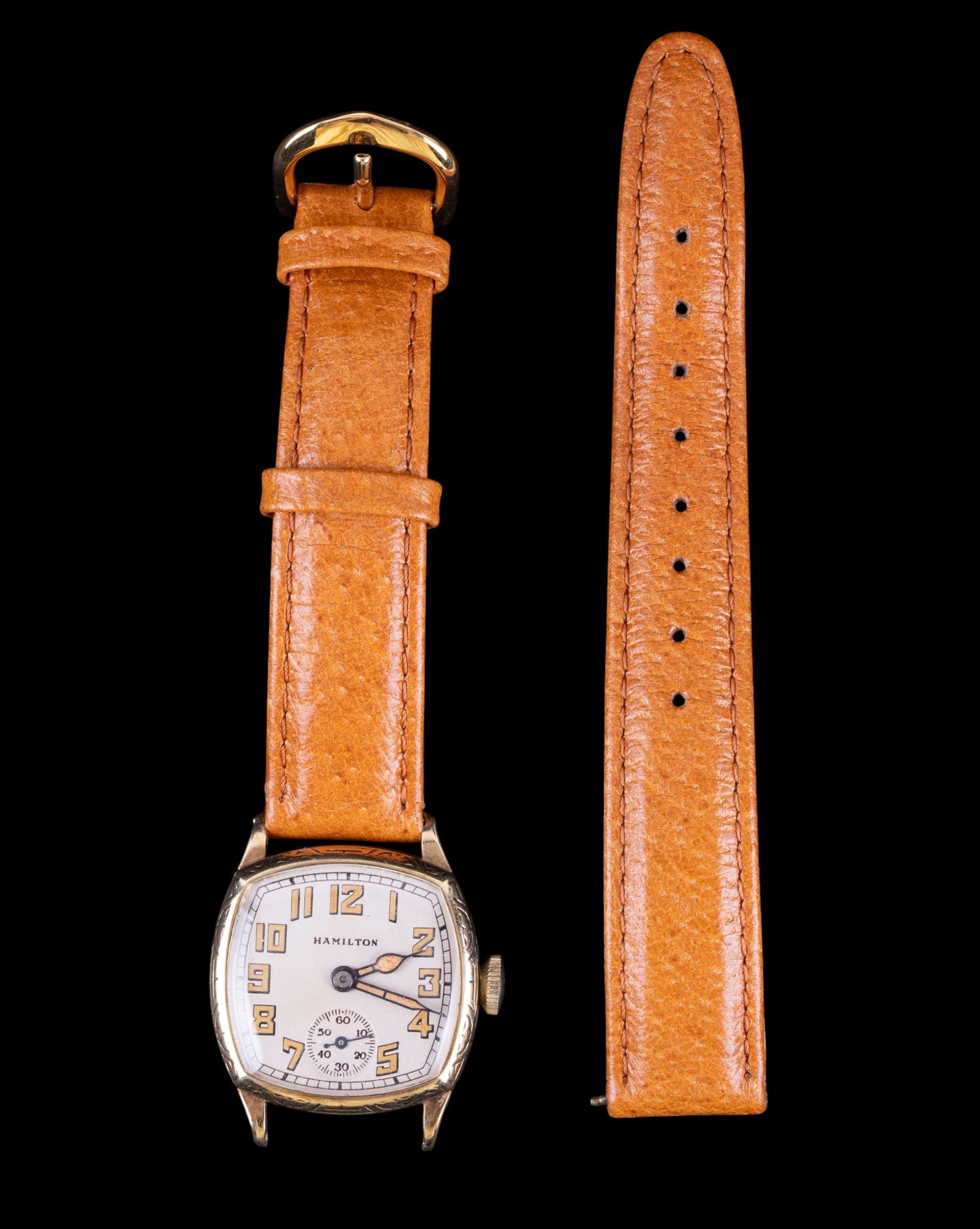 Hamilton 14K Gold Wrist Watch: A Hamilton 17 jewel movement #2296247 in a Wadsworth 14K gold case #0124394. Includes light brown leather band, will require reattachment.