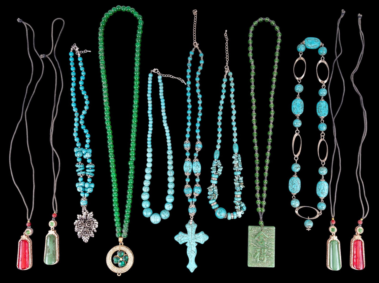 Chinese Pendants and Howlite Jewelry: A collection of Chinese green hardstone jewelry including pendants and bead strands, and an assortment of five turquoise dyed howlite necklaces. Longest measures approx. 14" on the drop.