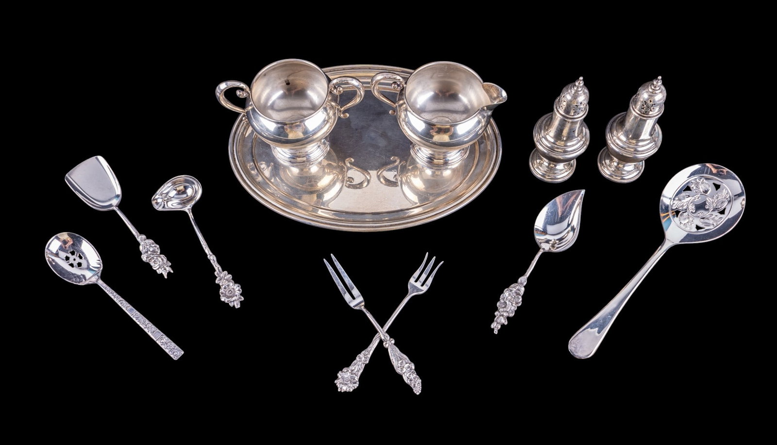 Gorham Sterling, Whiting Weighted Sterling, & More: A sterling silver oval tray by Gorham No. 13686, approx. 9.75" W x 7" D, a pair of Gorham No. 788 sterling silver salt and pepper shakers, a set of weighted sterling silver cream and sugar, and variou