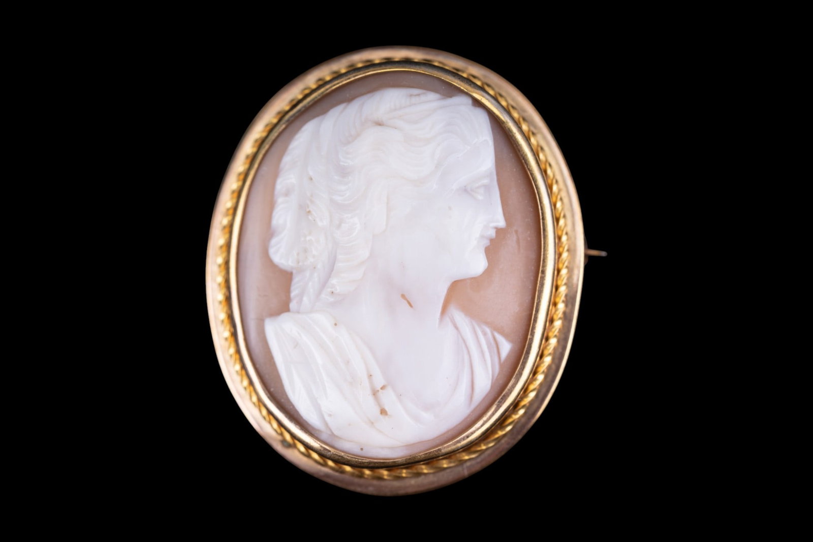 Gold Victorian Cameo Brooch/Pendant: An antique Victorian low grade gold framed shell cameo brooch / pendant, weighs approx. 15.7g, measures approx. 2" L x 1.5" W. Did not pass test at 10k.