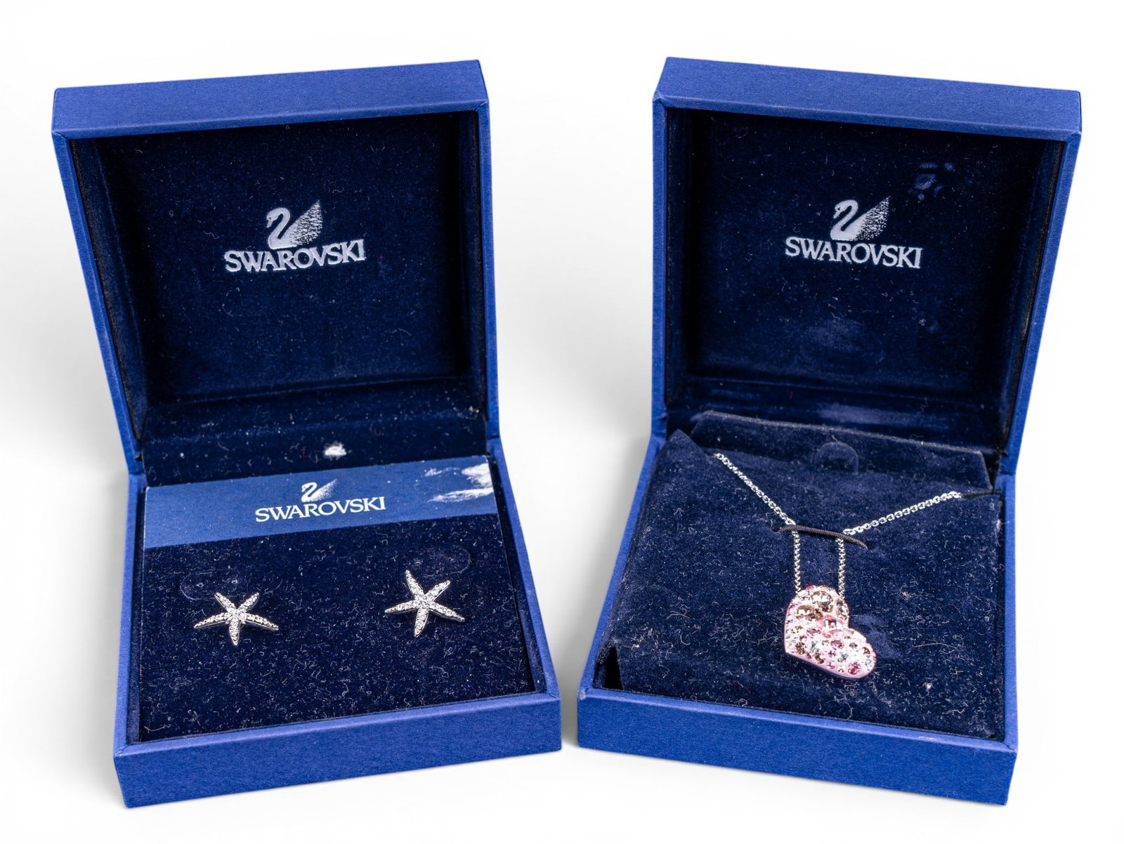 Swarovski Necklace & Earrings: Crystal heart puff necklace and clear crystal "starfish" earrings.