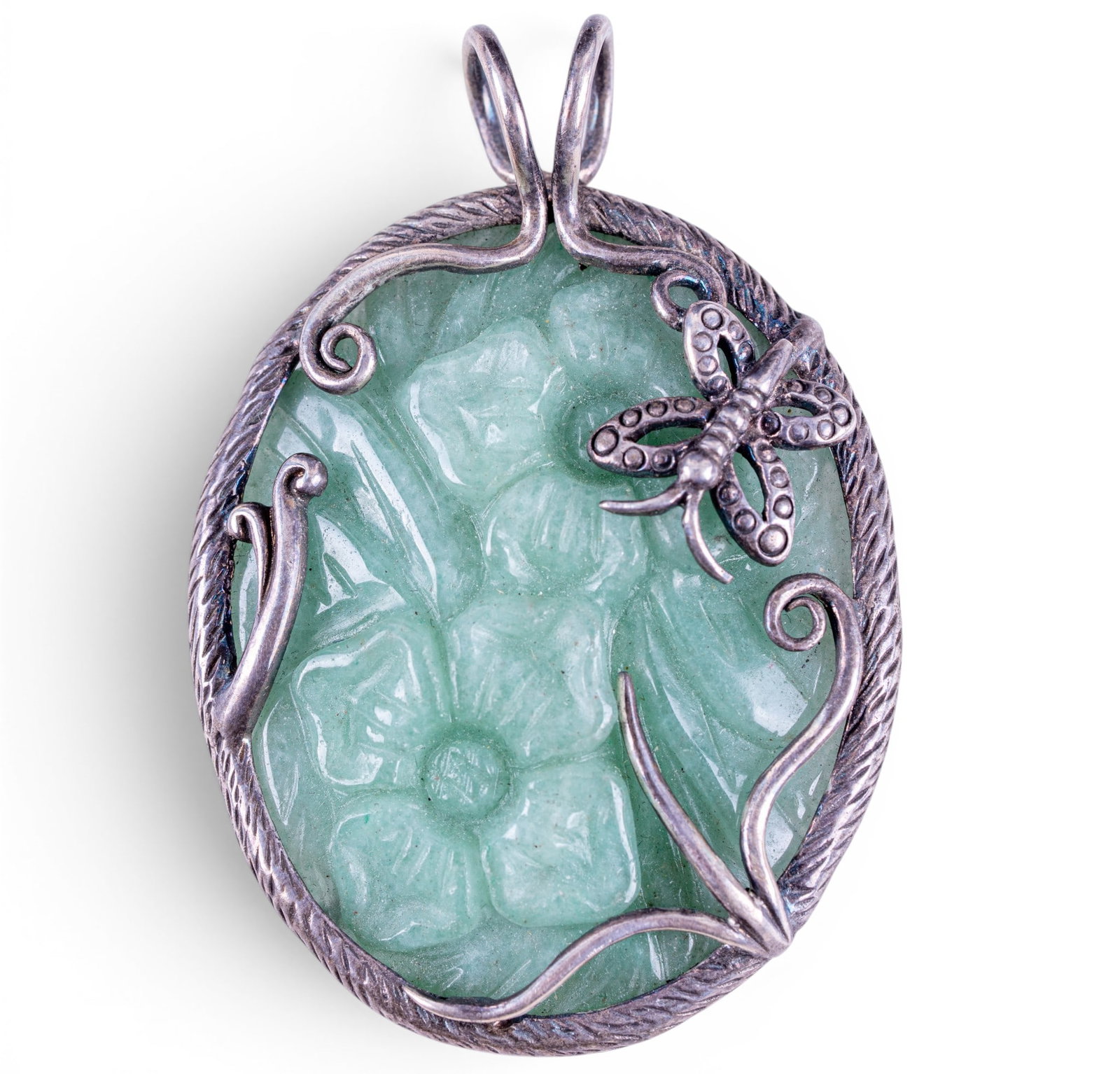 Jade and Sterling Pendant: Oval green jade carved pendant, set in sterling with butterfly detail.
