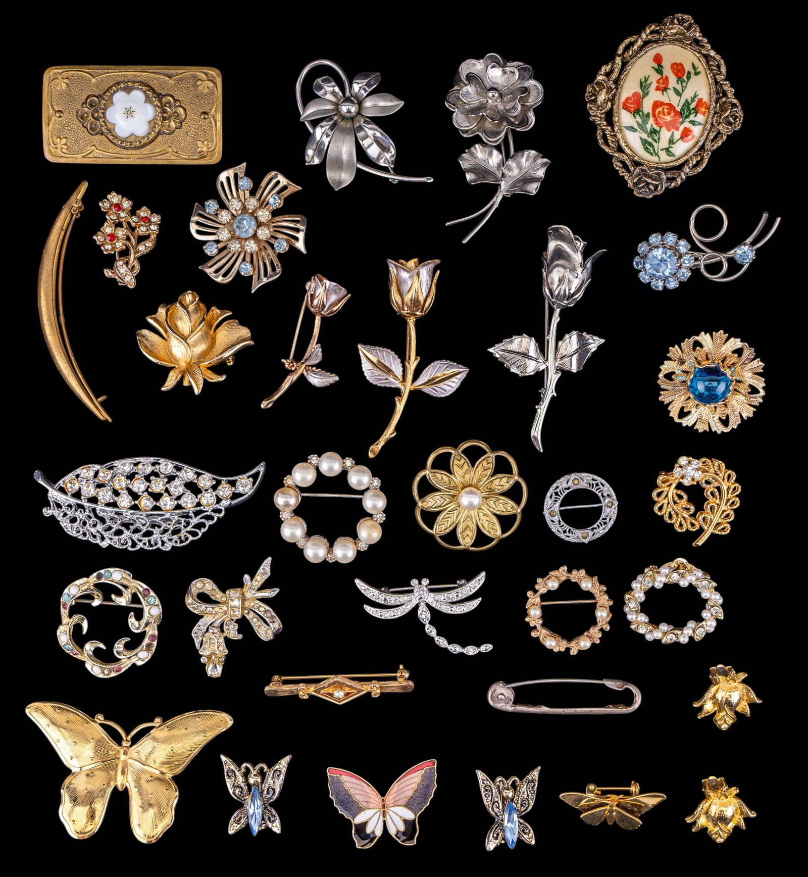 Napier Sterling and Vintage Jewelry: A vintage sterling Napier diaper pin and a large selection of vintage brooches.