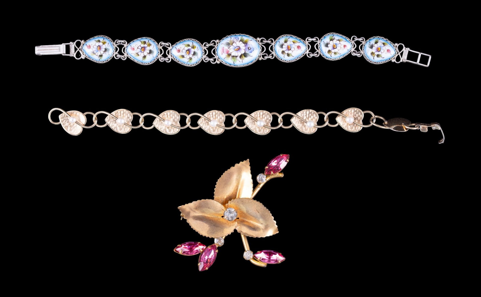 Krementz and Other Vintage Jewelry: A vintage Krementz heart and pearl gold tone bracelet, a painted enamel bracelet, and a vintage gold tone and pink rhinestone brooch marked 'Natalie'.