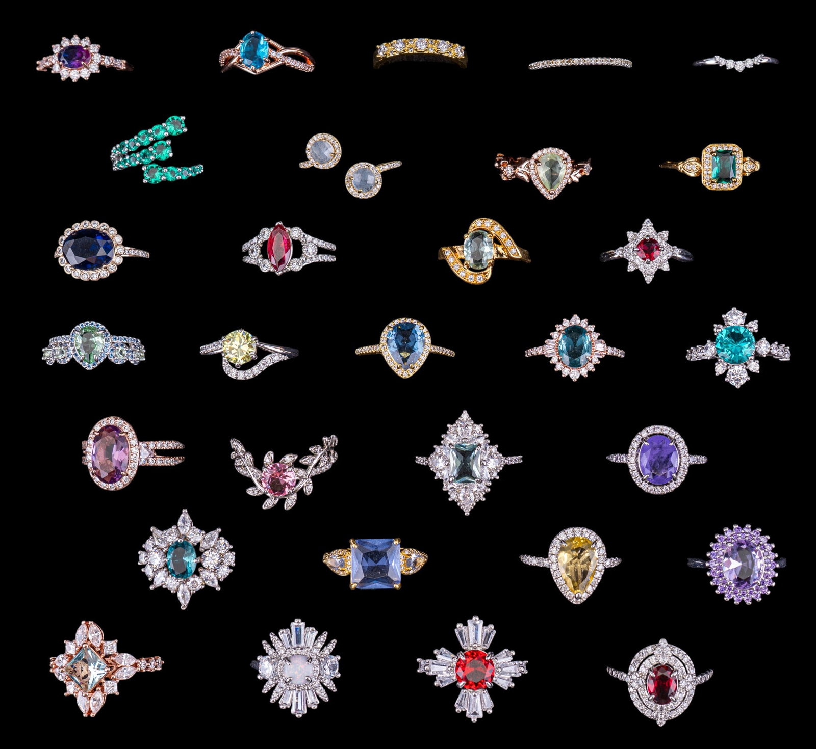 Bomb Party and Other Rhinestone Costume Rings (30): A collection of 30 costume rings including gold tone, rose gold tone, and silver tone with facet cut rhinestones, some signed 'Bomb Party', sizes range from 7 to 8.