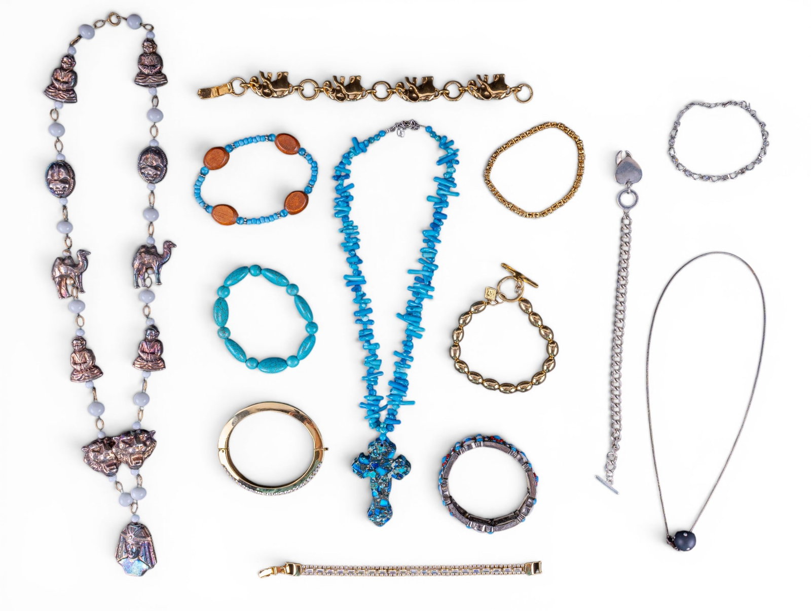 Vintage Costume Jewelry: A collection of vintage costume jewelry including a dyed coral chunk necklace with turquoise agate Cross pendant, an 18K RGP heart and rhinestone bracelet, a guitar cord necklace with sterling clasp, 