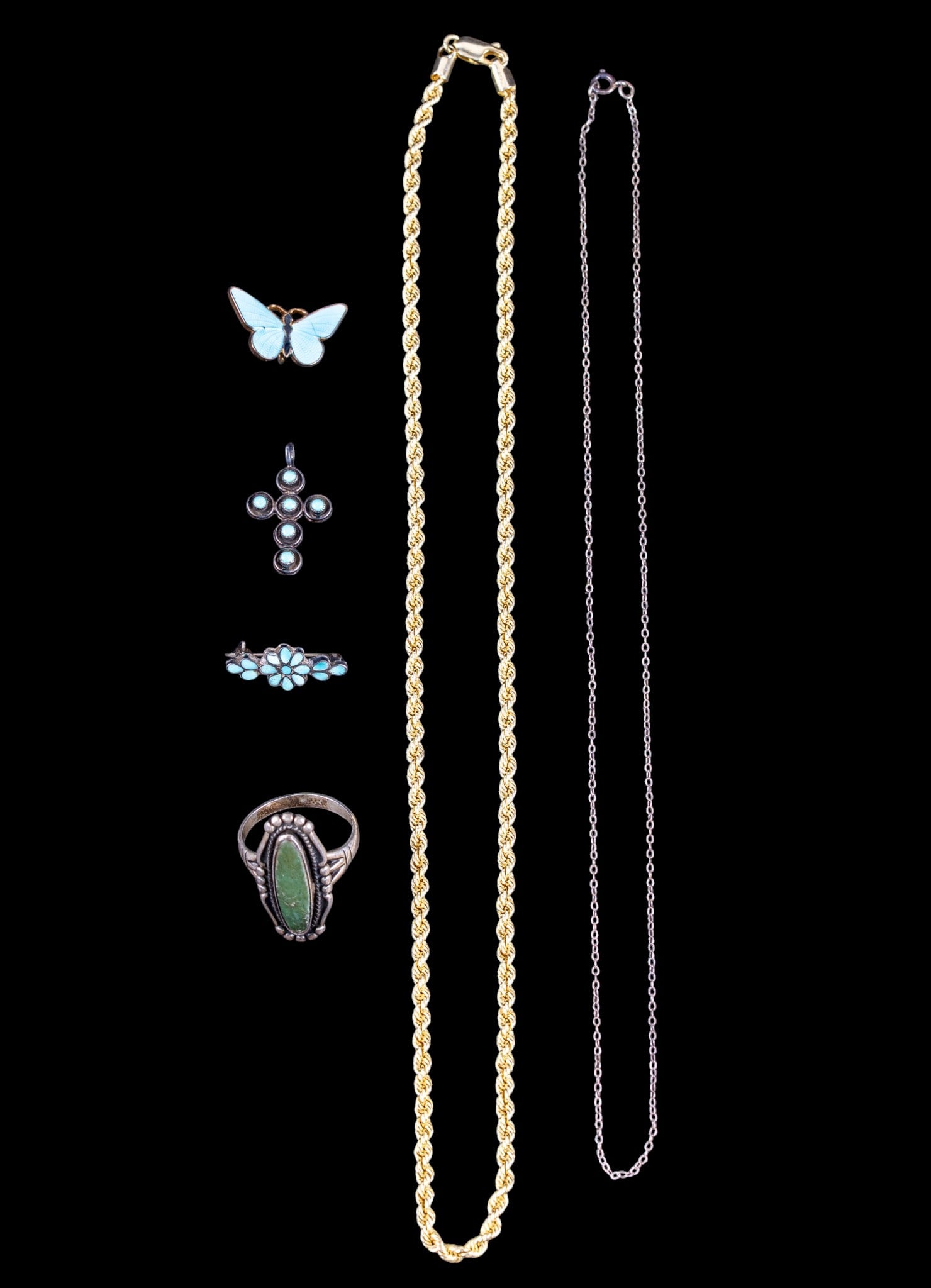 Sterling and Other Jewelry: Sterling silver artisan crafted Navette ring with green stone center, size 12, a turquoise and coral cabochon Cross pendant, a turquoise inlay floral bar brooch, a gold tone guilloche enamel butterfly