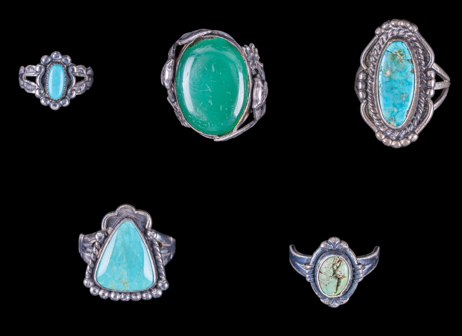 Native and Mexican Sterling Rings (5): A collection of Native and Mexican sterling rings featuring turquoise cabochons, sizes range from 3.5 to 7, total weight is approx. 0.8oz.