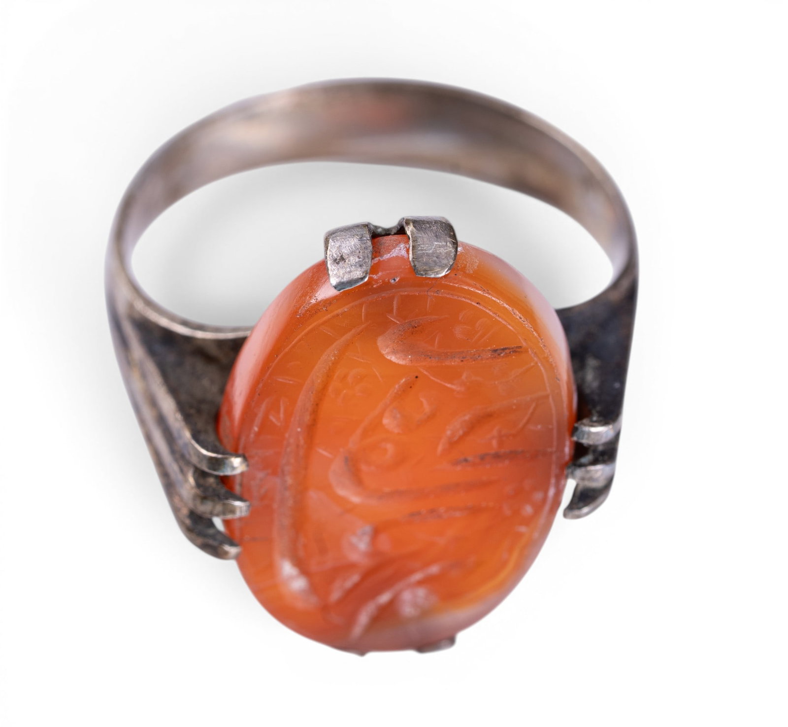 19th C Unmarked Sterling & Carnelian Ring: A 19th C unmarked sterling silver ring with carved carnelian center featuring Arabic lettering, size 7.5, total weight is approx. 0.2oz.