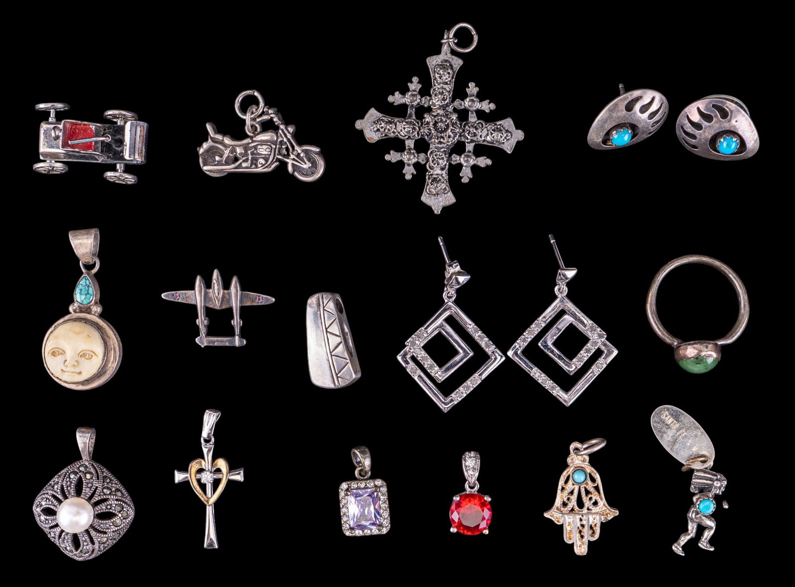 Sterling Silver Earrings, Charms, & Pendants: A collection of sterling silver stud earrings, figural charms, pendants, and unmarked ring. Total weight is approx. 1.4oz.