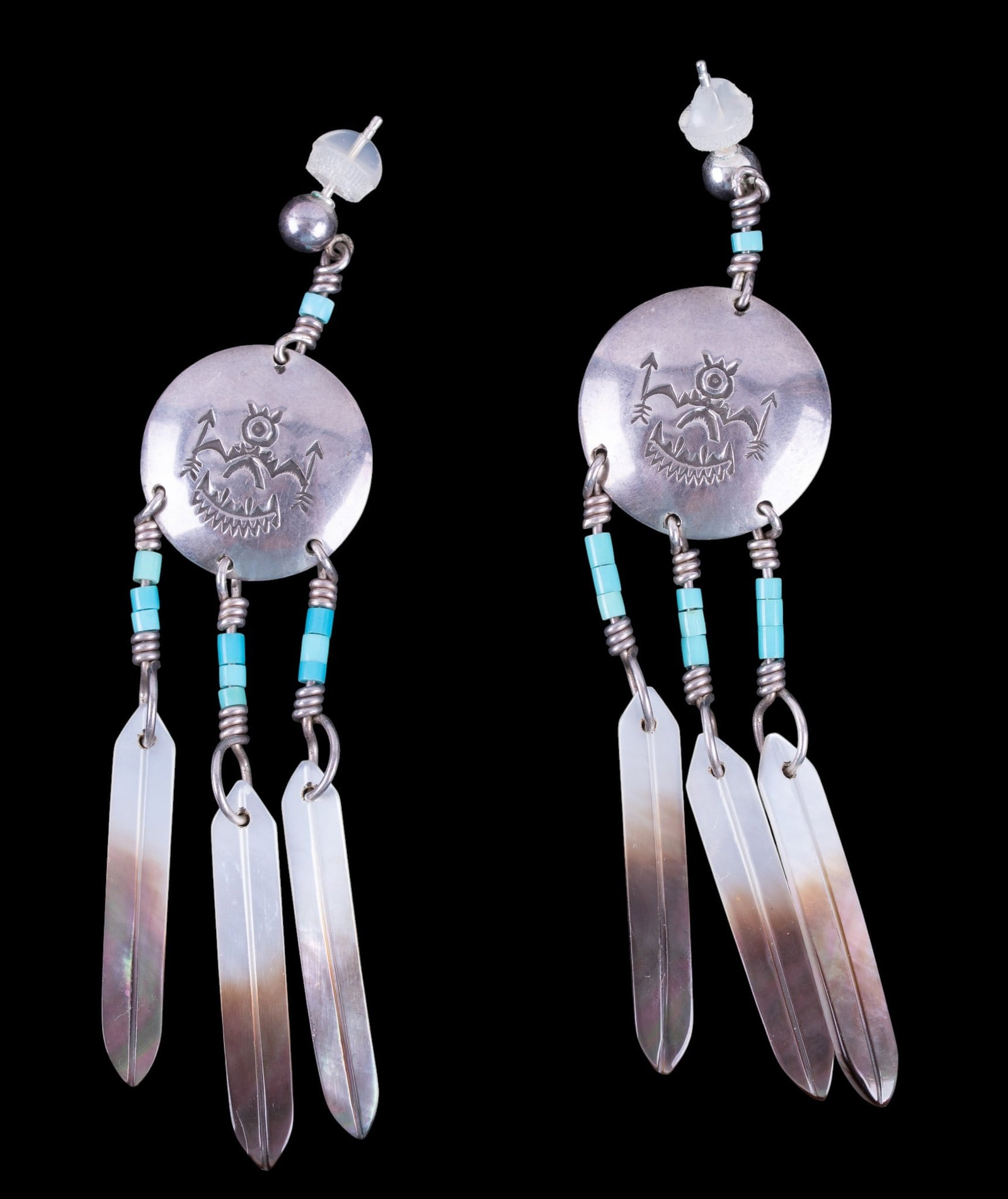 Native Signed Earrings: A pair of hand crafted sterling, shell, and turquoise dangle earrings signed 'R.O. 74' on the reverse. Total weight is approx. 0.4oz