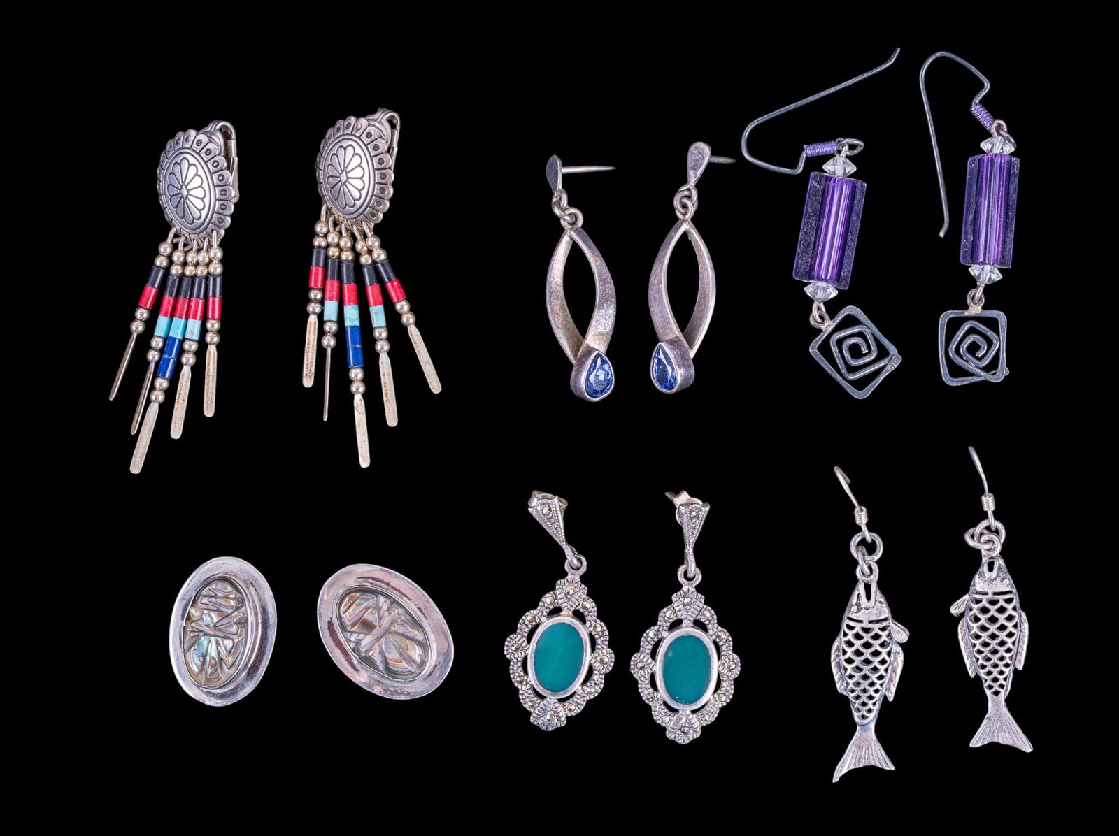 Art Deco, Concho, and Other Sterling Earrings: A collection of six pairs of sterling silver earrings including concho clip ons, Art Deco dangle earrings with green stone and marcasite, fish on French Hooks, blue teardrop cut stone and sterling ear